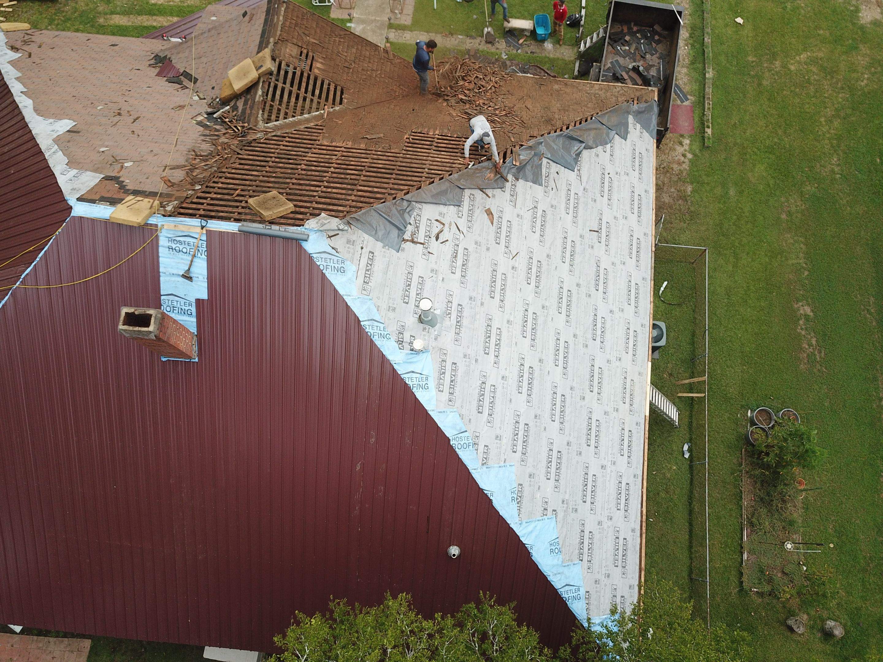 Residential Metal Roof Replacement using Reed's Metals: Colored Residental Panel (Burgundy) by Hostetler Roofing