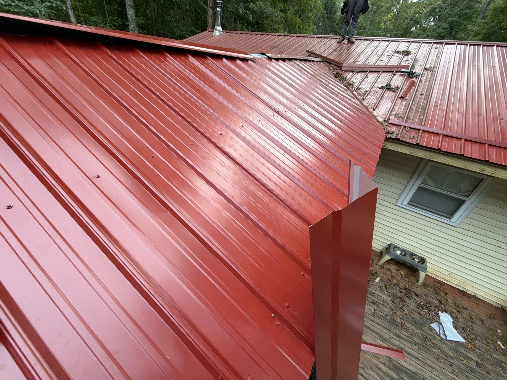 Red Metal Roof Restoration and Wood Fascia Replacement in Barboursville by Cade Construction