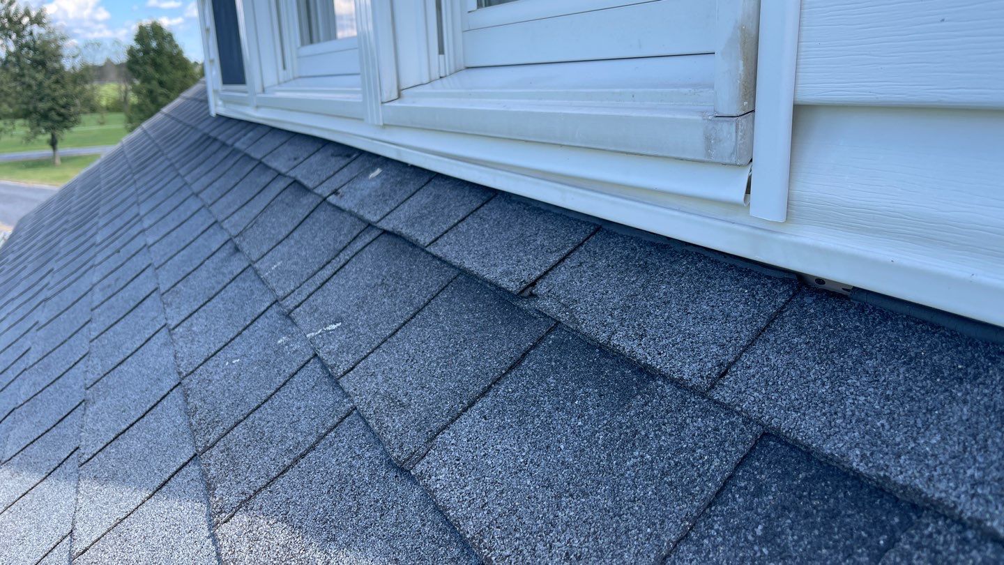 Roof Damage using Certainteed Lifetime Roofing System- Moire Black Landmark Pro shingkes with shadow ridge caps. by BulletpROOF Exteriors