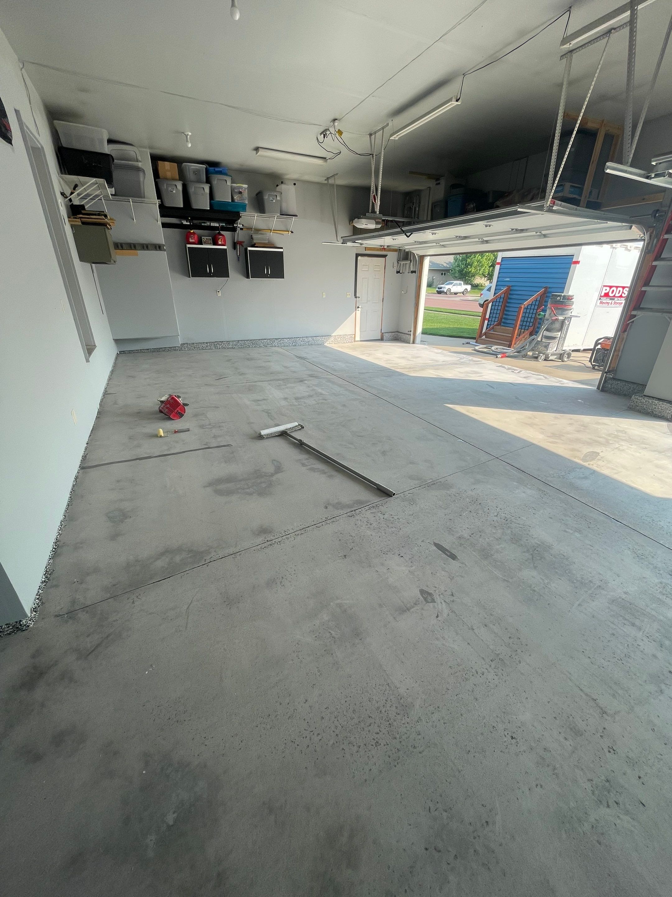 Sioux Falls Garage Concrete Coating Installation with Domino Flake by Select Painting, Coatings & Garage Cabinets