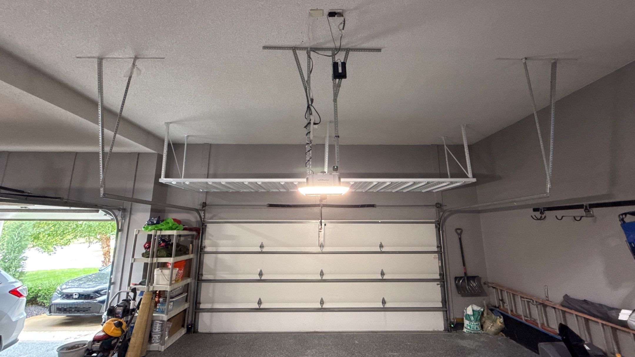 Ceiling Mounted Overhead Storage Rack Installation in Shawnee by Banner Garage