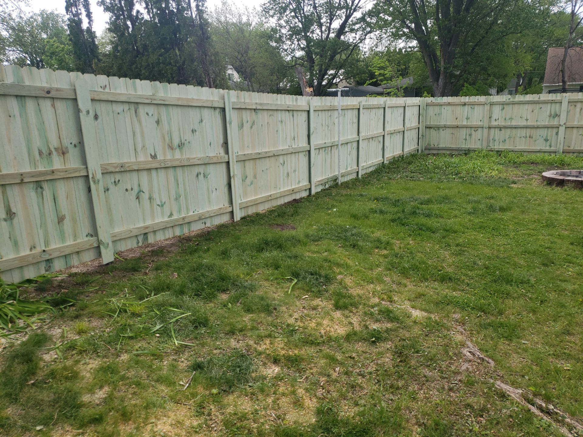 Pressure-Treated Wood Privacy Fence Installation in Waterloo by Perfect Picket Fence and Stain