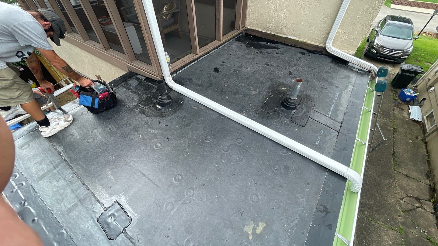 Rubber Roof and Gutter on Addition  by Secure Construction Company Inc