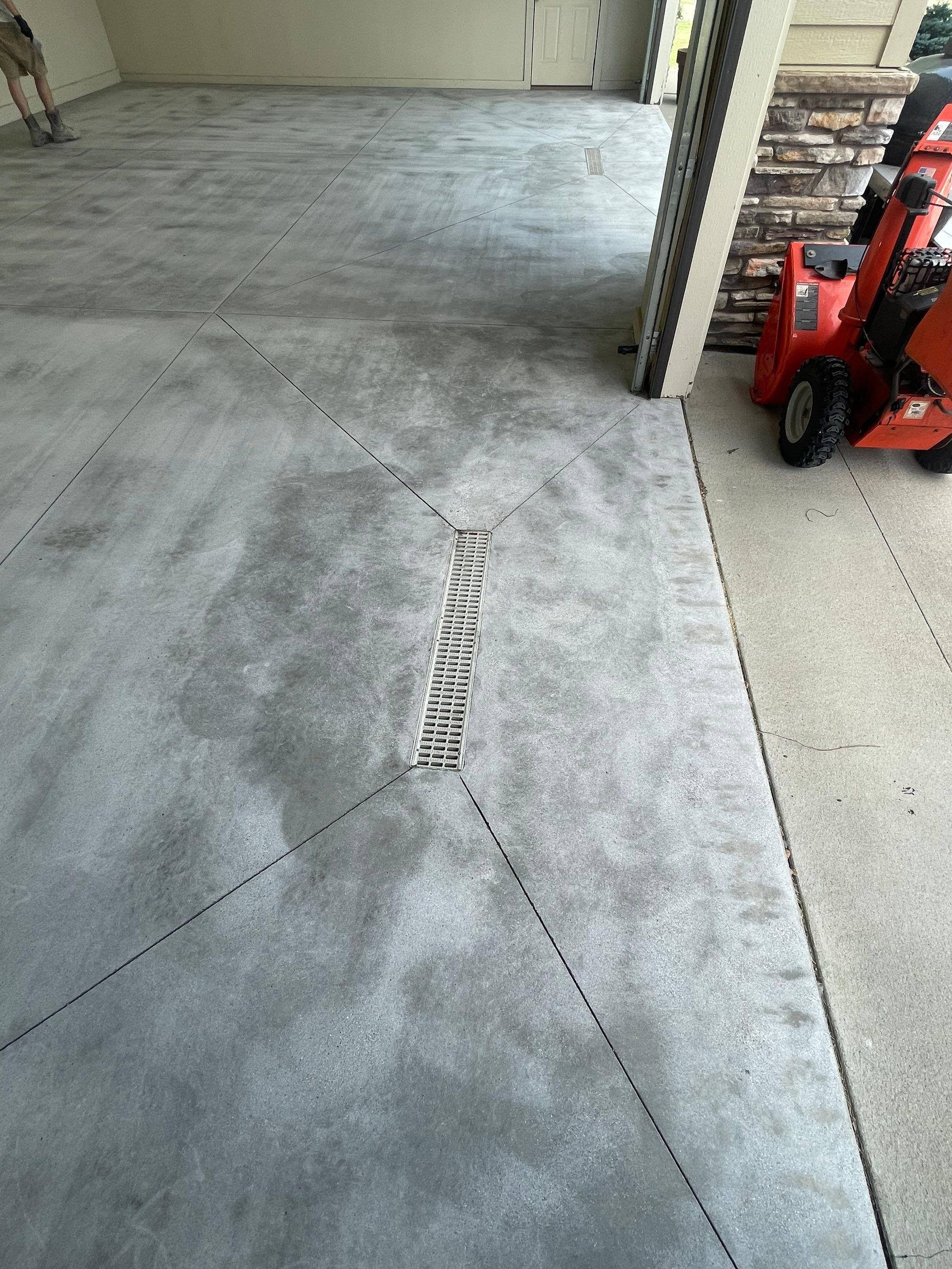 Coyote Flake Garage Floor Coating in Sioux Falls with Trench Drain by Select Painting, Coatings & Garage Cabinets