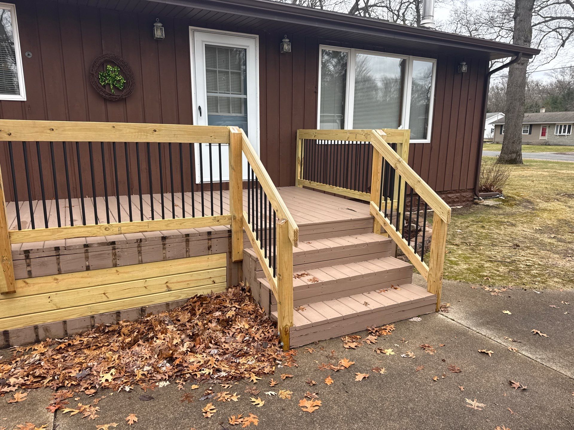 Muskegon Deck Restoration with Pressure Treated Railings and Wood Staining by Gordon Painting