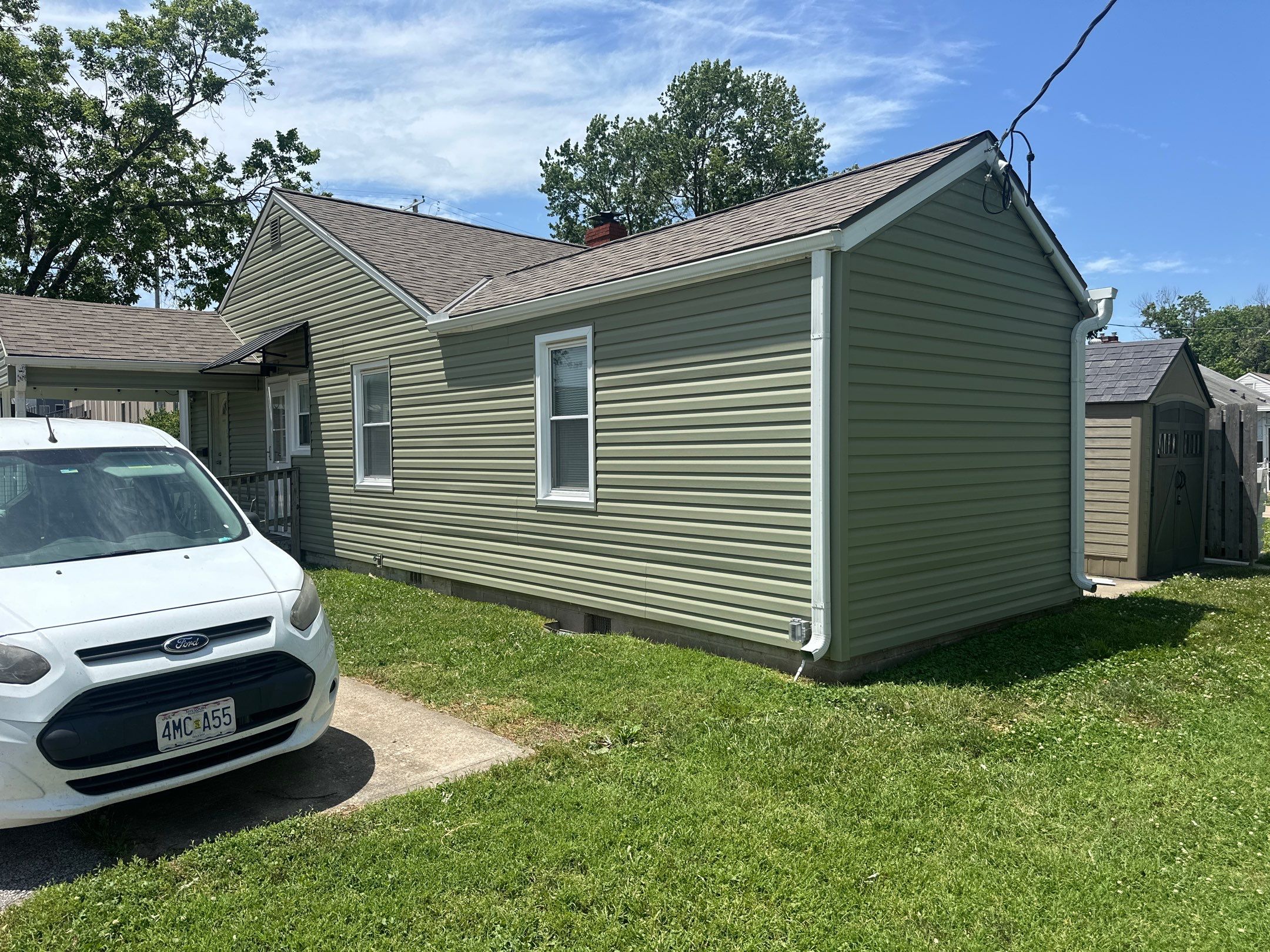 New Cypress Siding going on this North Kansas City Home  by EEC  Windows, Siding & Roofing 