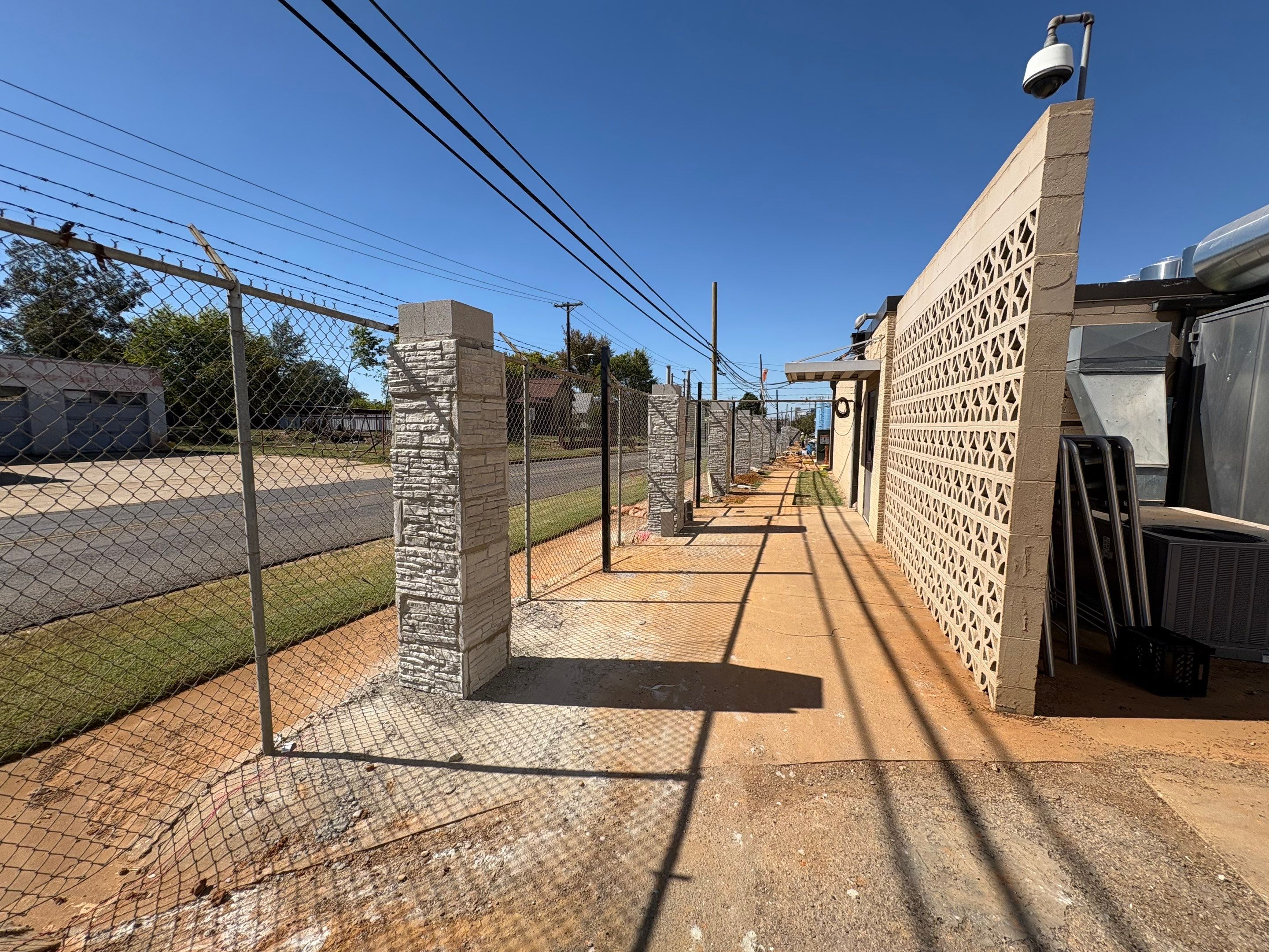 Commercial Fencing - Wrought Iron with Concrete columns by 3:16 Roofing and Construction