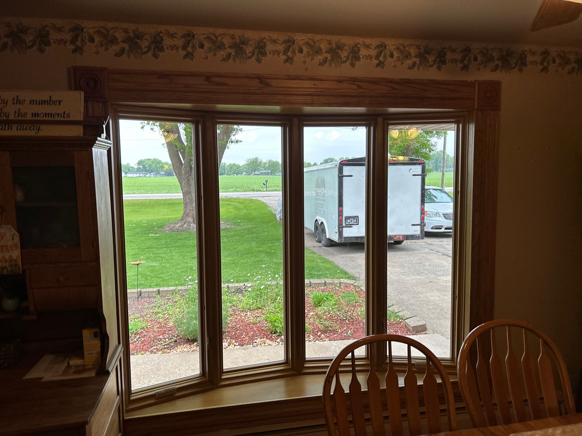 Bow window replacment using Pella Lifestyle wood/Aluminum window by United Windows and Siding LLC