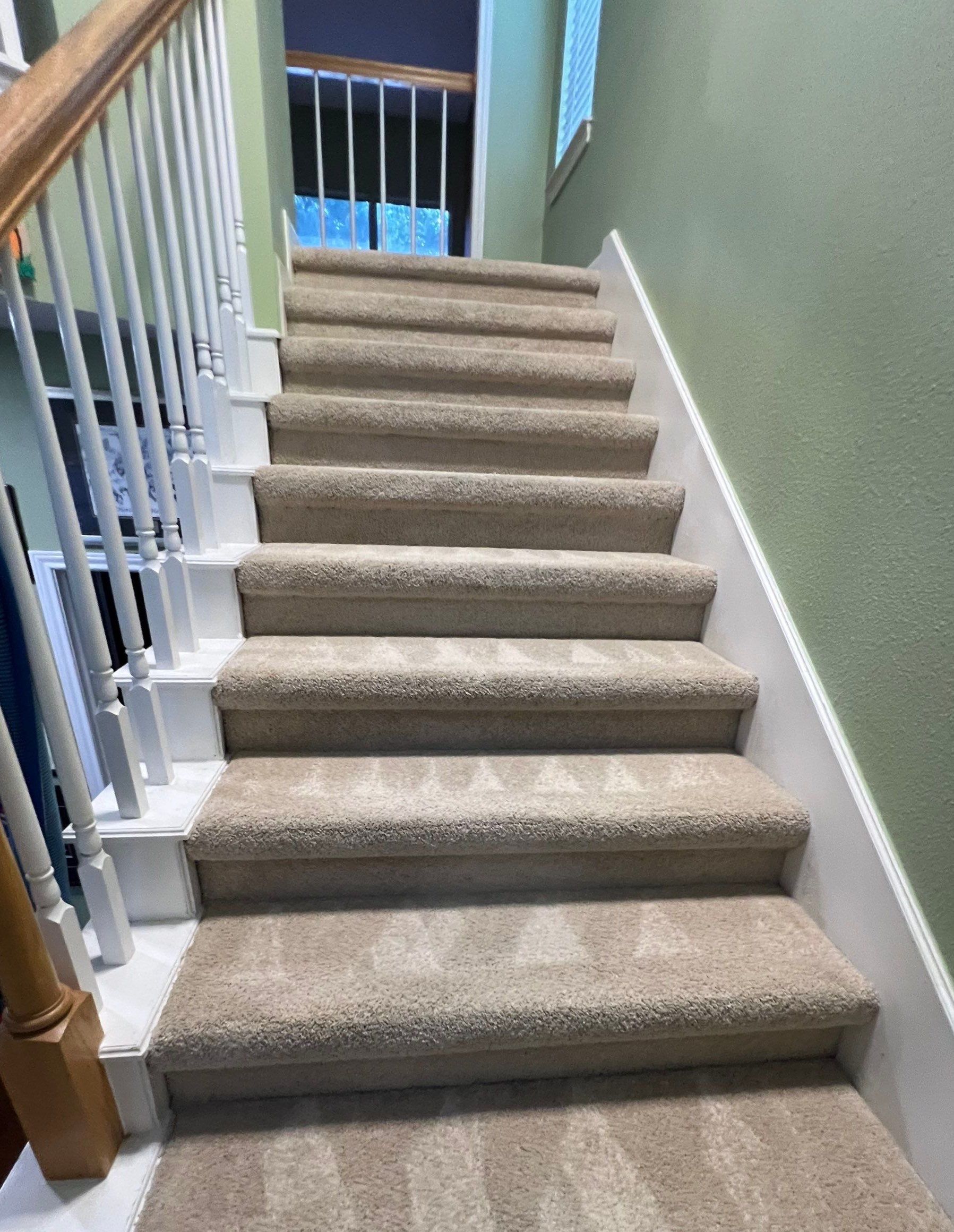 the carpet on the stairs is being cleaned and refreshed to remove dirt and stains for a cleaner appearance