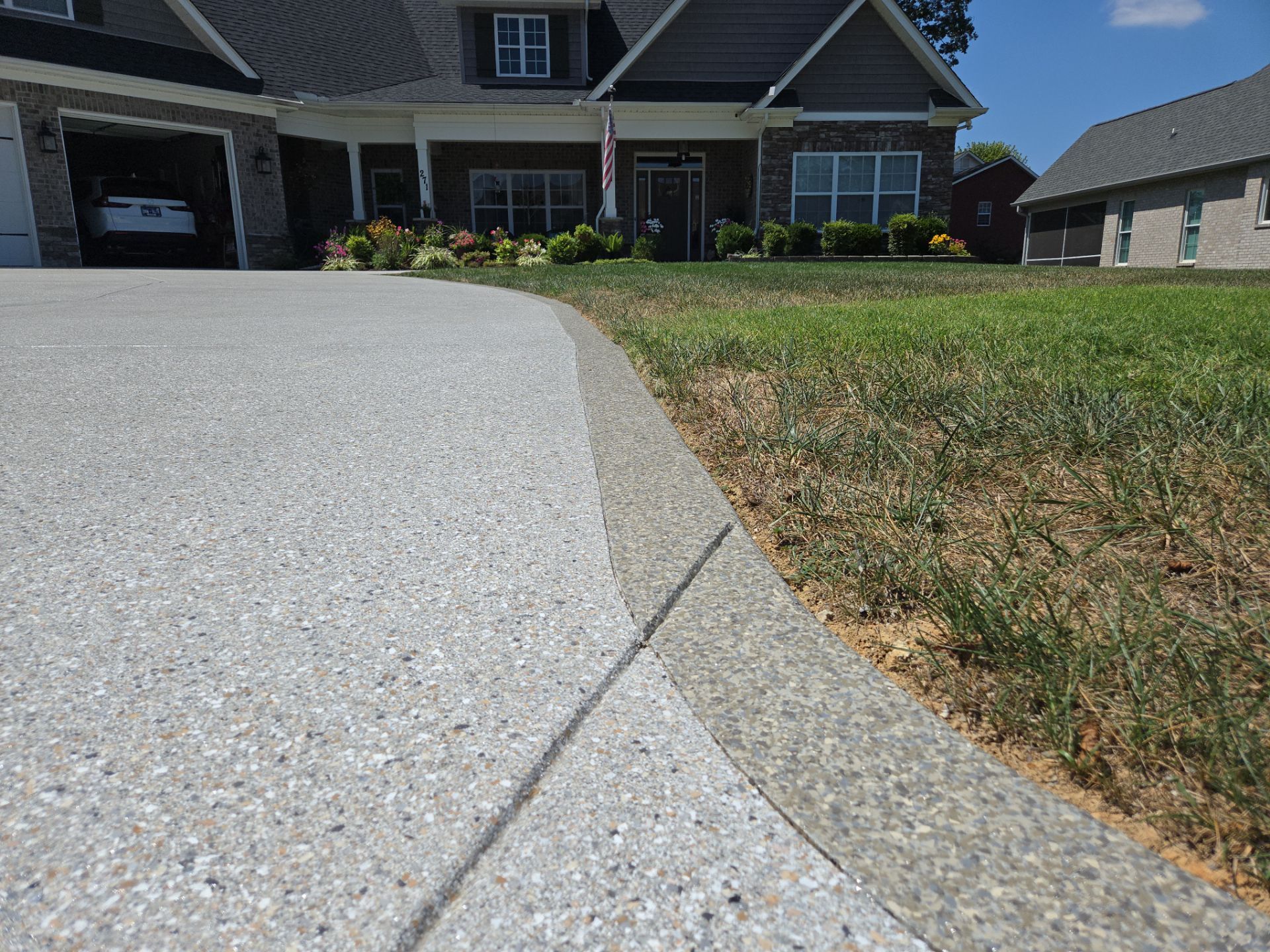 Driveway Improvement Using Claystone With Trail Mix Border! by Elite Floor Solutions