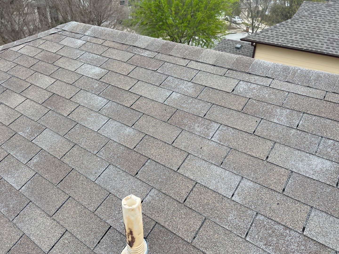 Wind damaged roof replacement by Oakwood Roofing and Construction, LLC
