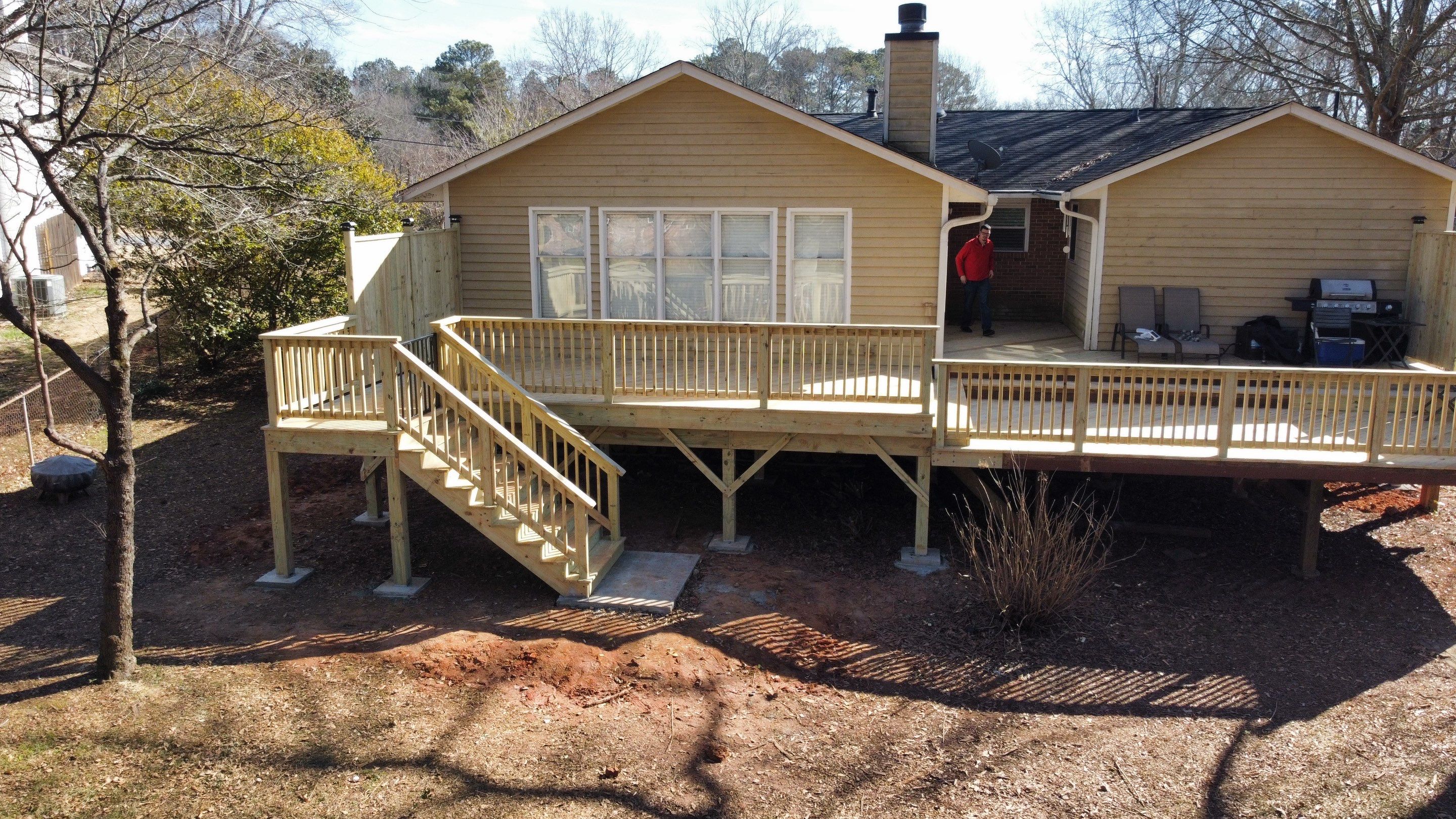 Elevated Pressure-Treated Wood Deck Extension in Marietta by Swift Home Renovations