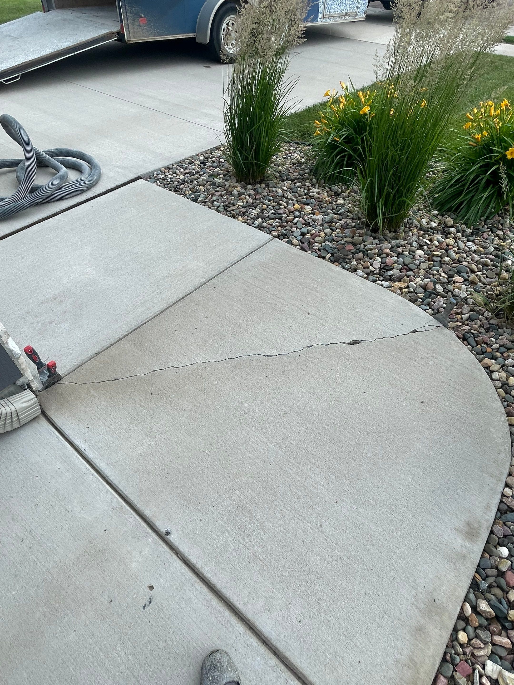 Textured Concrete Patio Coating and Custom Privacy Pergola in Sioux Falls by Select Painting, Coatings & Garage Cabinets