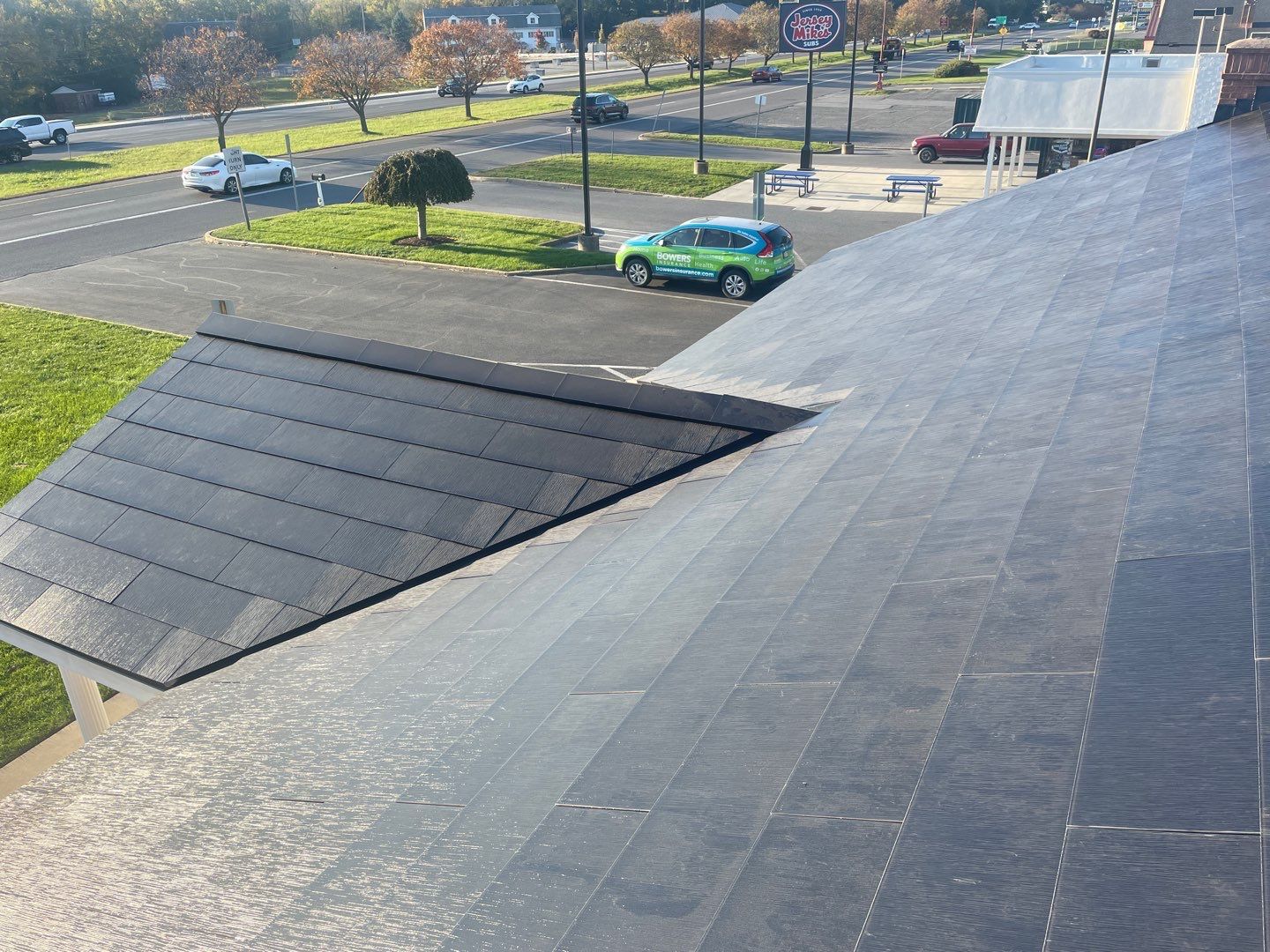 Tesla Solar Roof on a Commercial Building by American Home Contractors