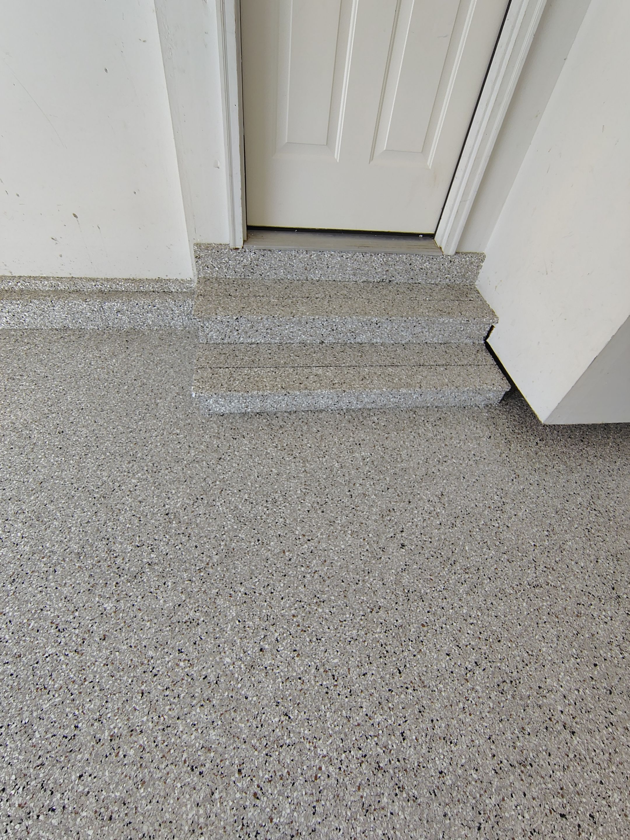 Decorative Chip Epoxy Garage Floor Coating in Sioux Falls by Select Painting, Coatings & Garage Cabinets