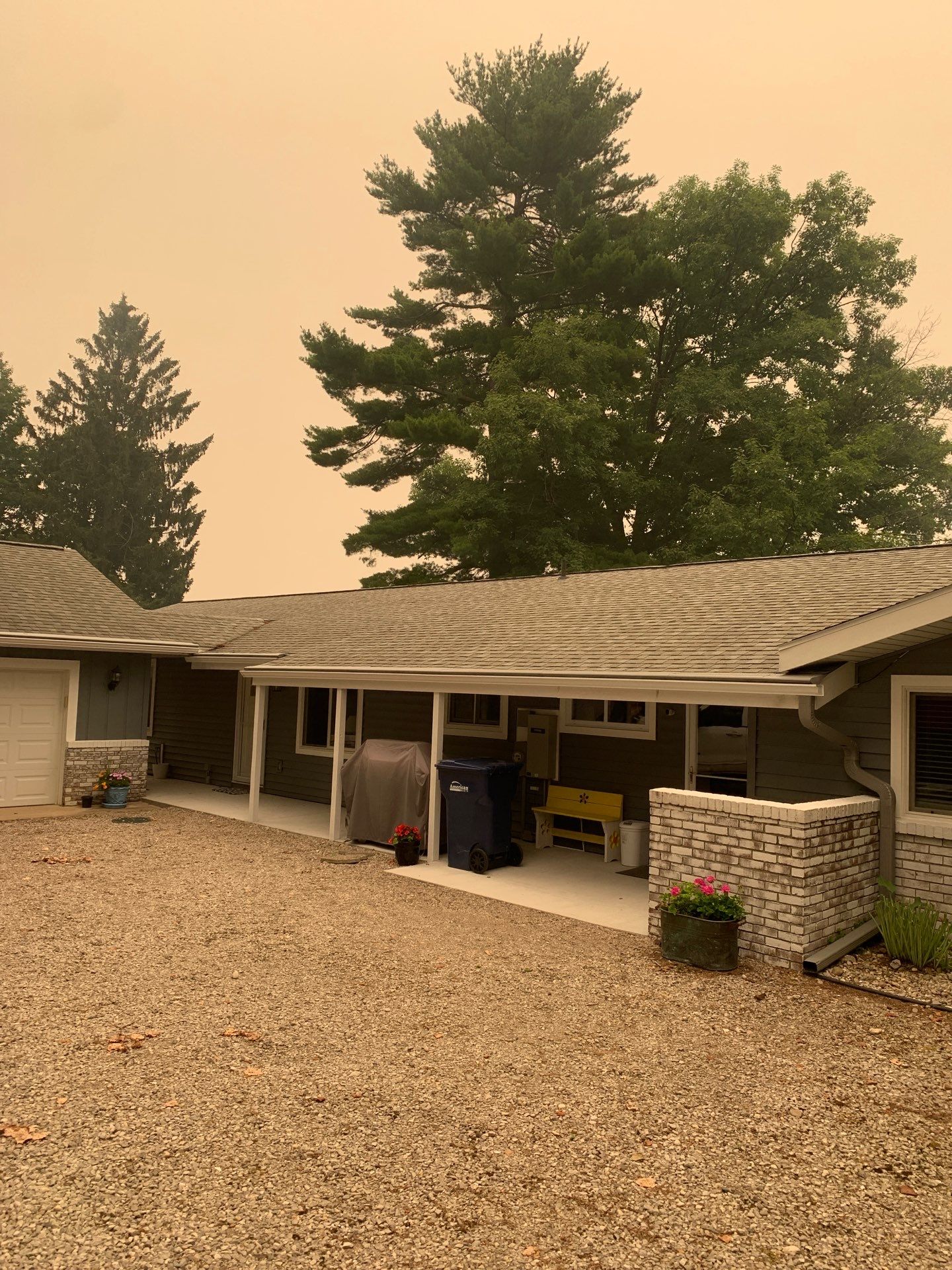 Gutter Helmet and White Seamless Gutter Installation in Rapid City by Rainbow Seamless Systems