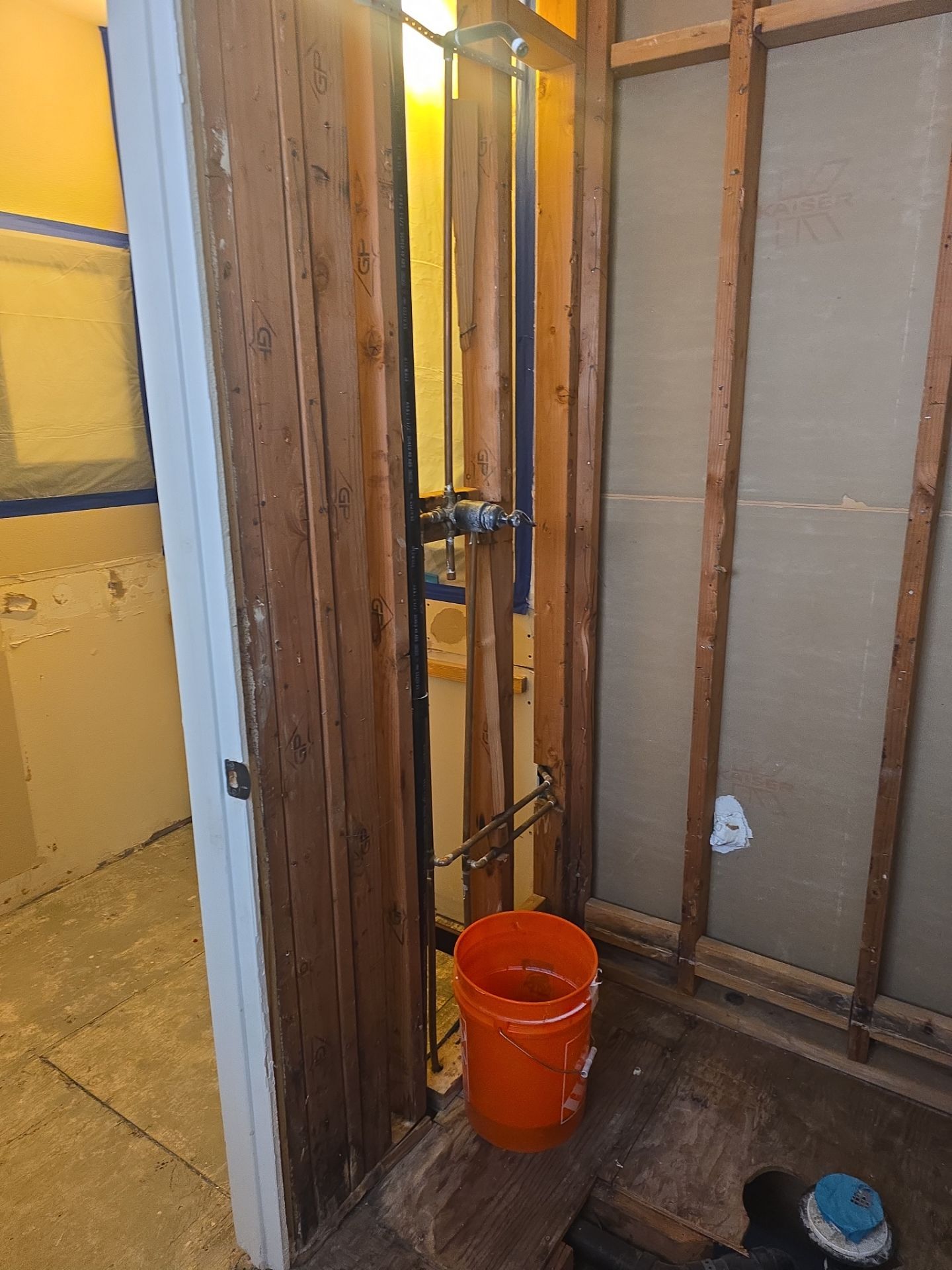 Inspecting Water Leak in Shower by Us Plumbing