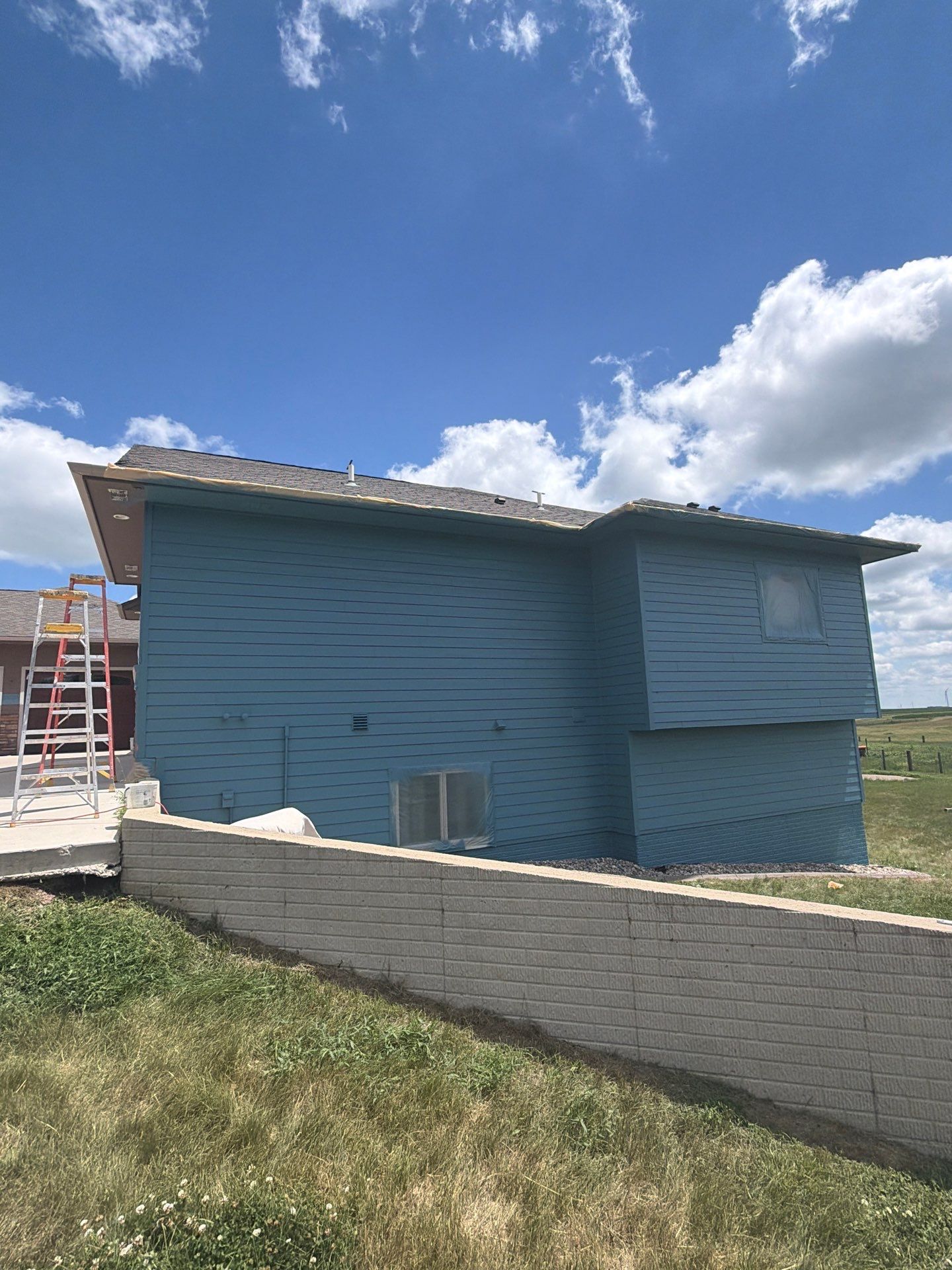 Full Exterior Siding Paint Restoration and Refresh in Garretson by Select Painting, Coatings & Garage Cabinets
