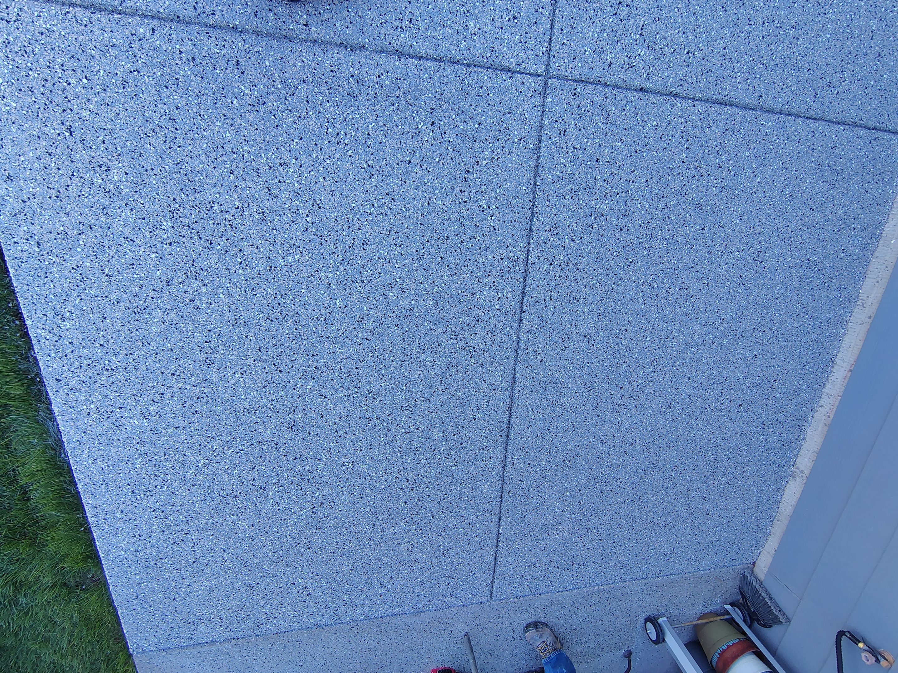 Speckled Concrete Patio Coating Installation in Sioux Falls by Select Painting, Coatings & Garage Cabinets