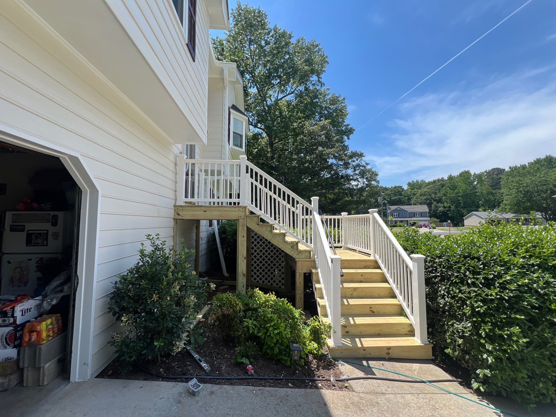 Front Entrance Deck Stair Replacement with White Vinyl Railings in Lawrenceville by Swift Home Renovations