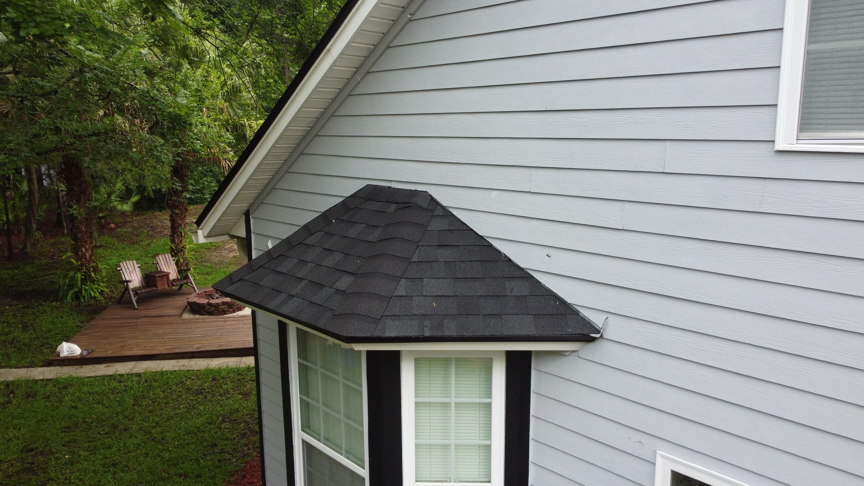 Complete Onyx Black Asphalt Shingle Roof Replacement and Skylight Installation in Jacksonville by Trinity Restoration and Roofing LLC