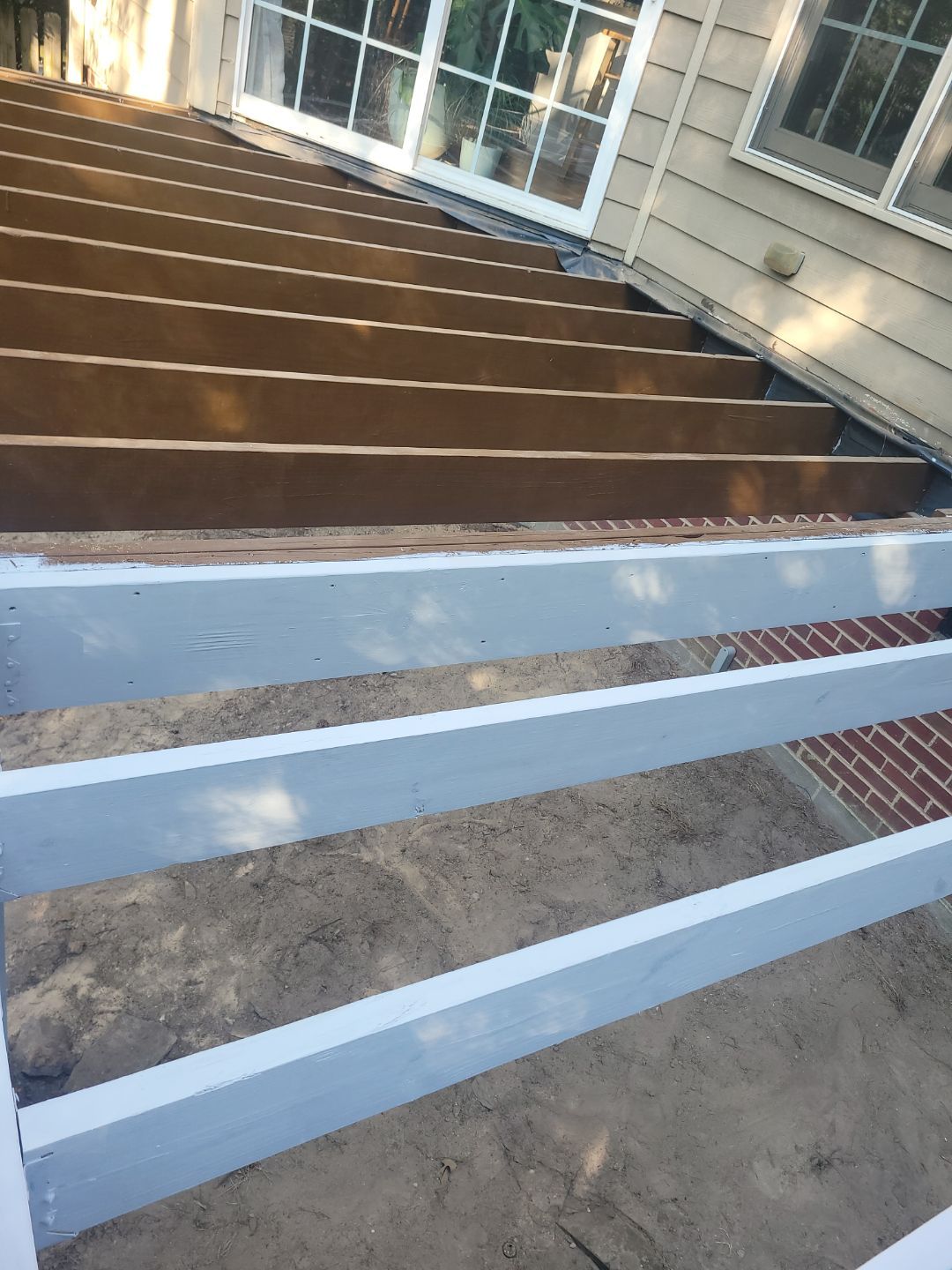 Fuquay-Varina Outdoor Upgrade – Composite Deck & Paved Landing by Elite Remodeling and Design LLC