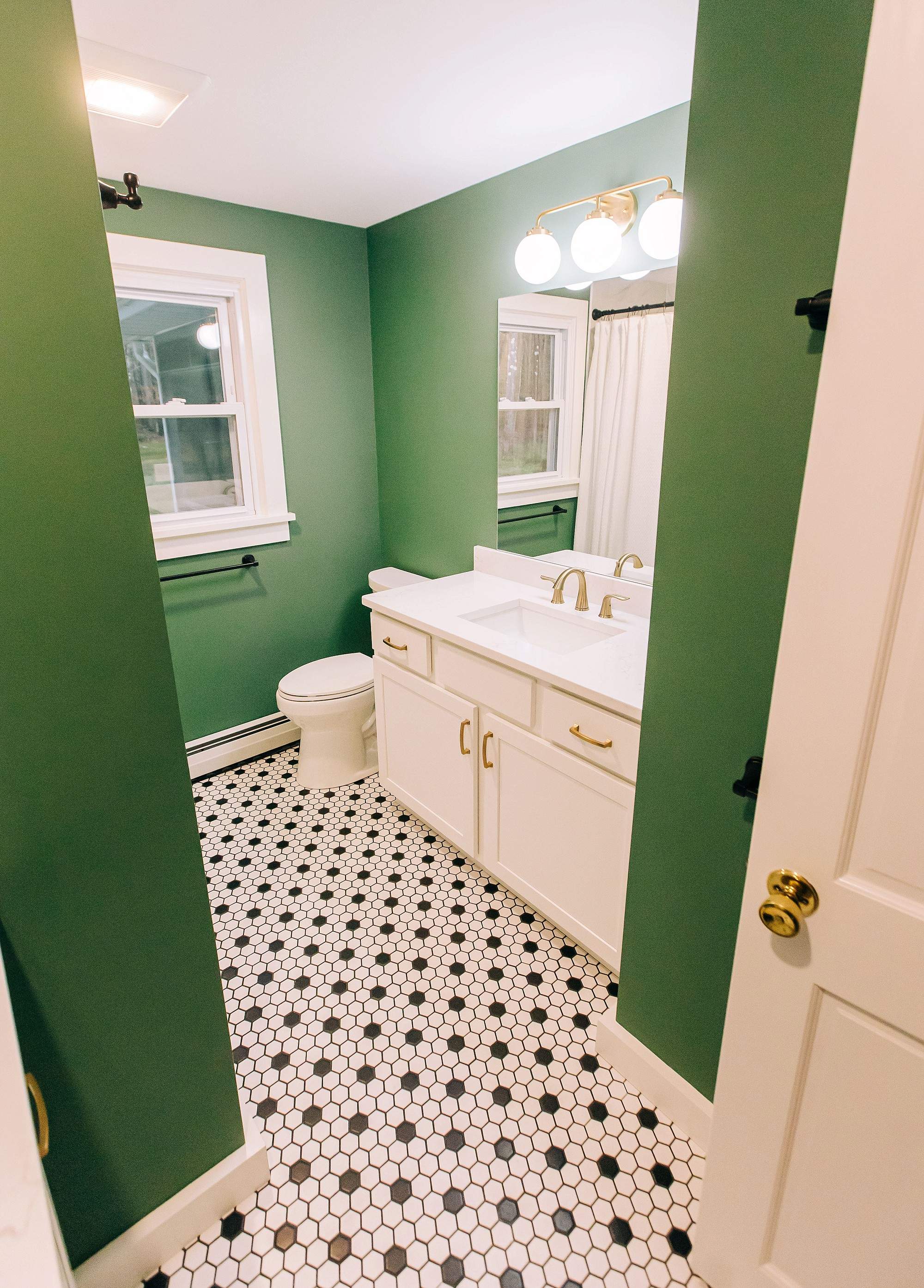 Green & Gold Bathroom by Renovatic LLC