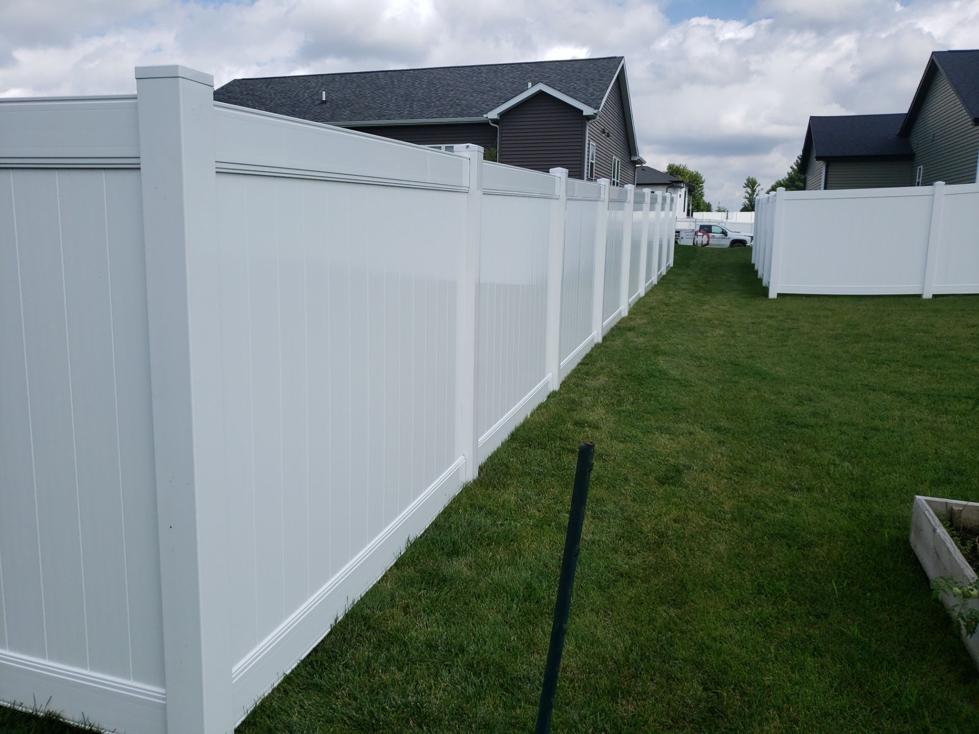 New Vinyl Privacy Fencing and Gates for Waterloo Residential Backyard by Perfect Picket Fence and Stain