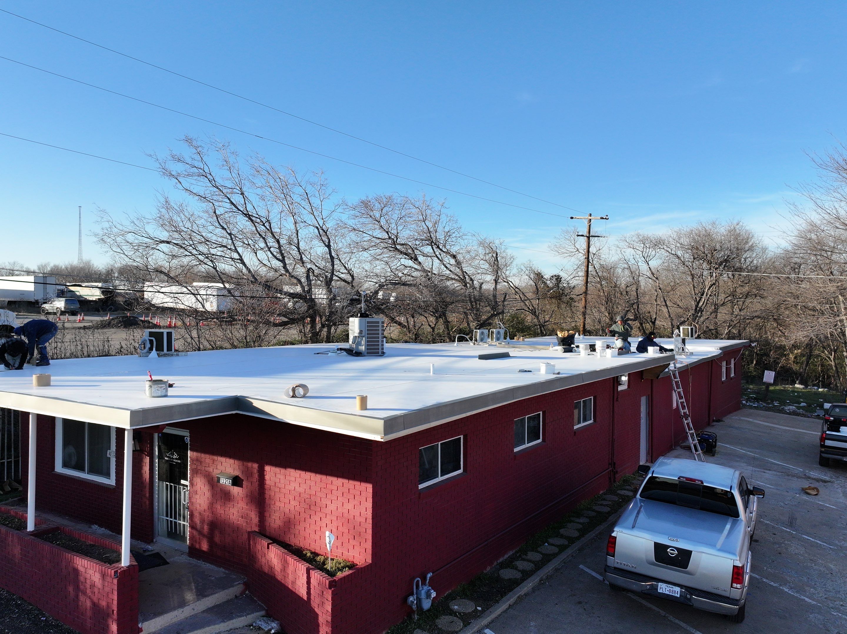 Commercial roofing overlay using GAF TPO over an old ballast roof by Becker Roofing and Exteriors