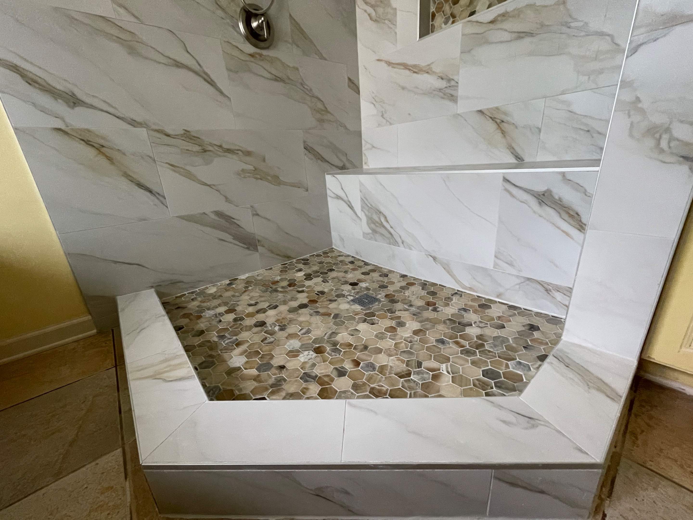 Master bathroom shower renovation, and tile flooring by Prudencio