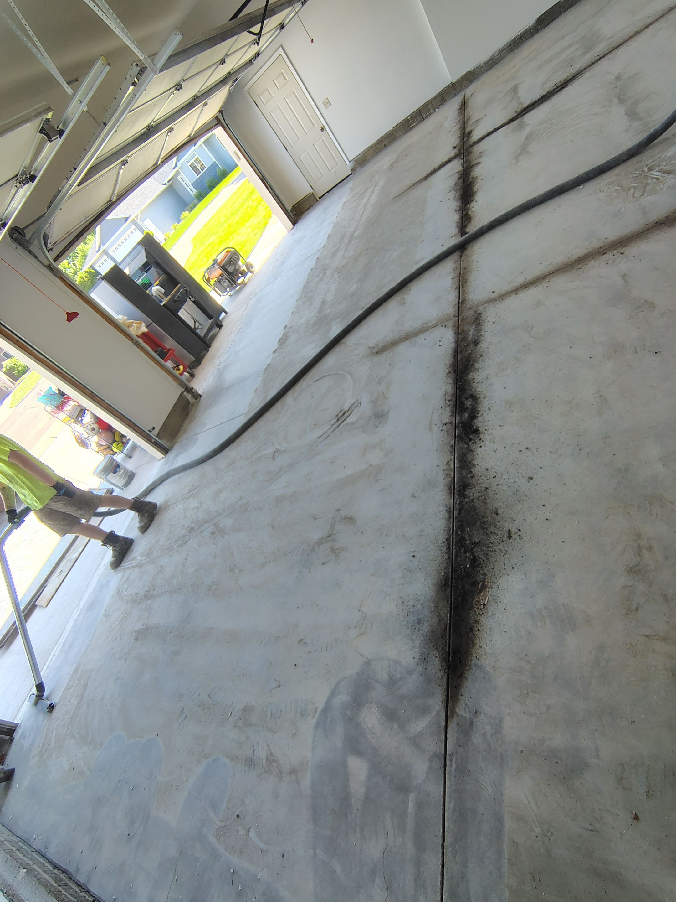Custom Grey Speckled Epoxy Floor Coating for Sioux Falls Garage by Select Painting, Coatings & Garage Cabinets
