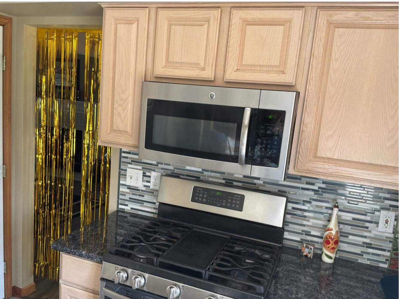 Kitchen Cabinet Refinishing and Hardware Upgrade in White Lake by Top Shelf Painter