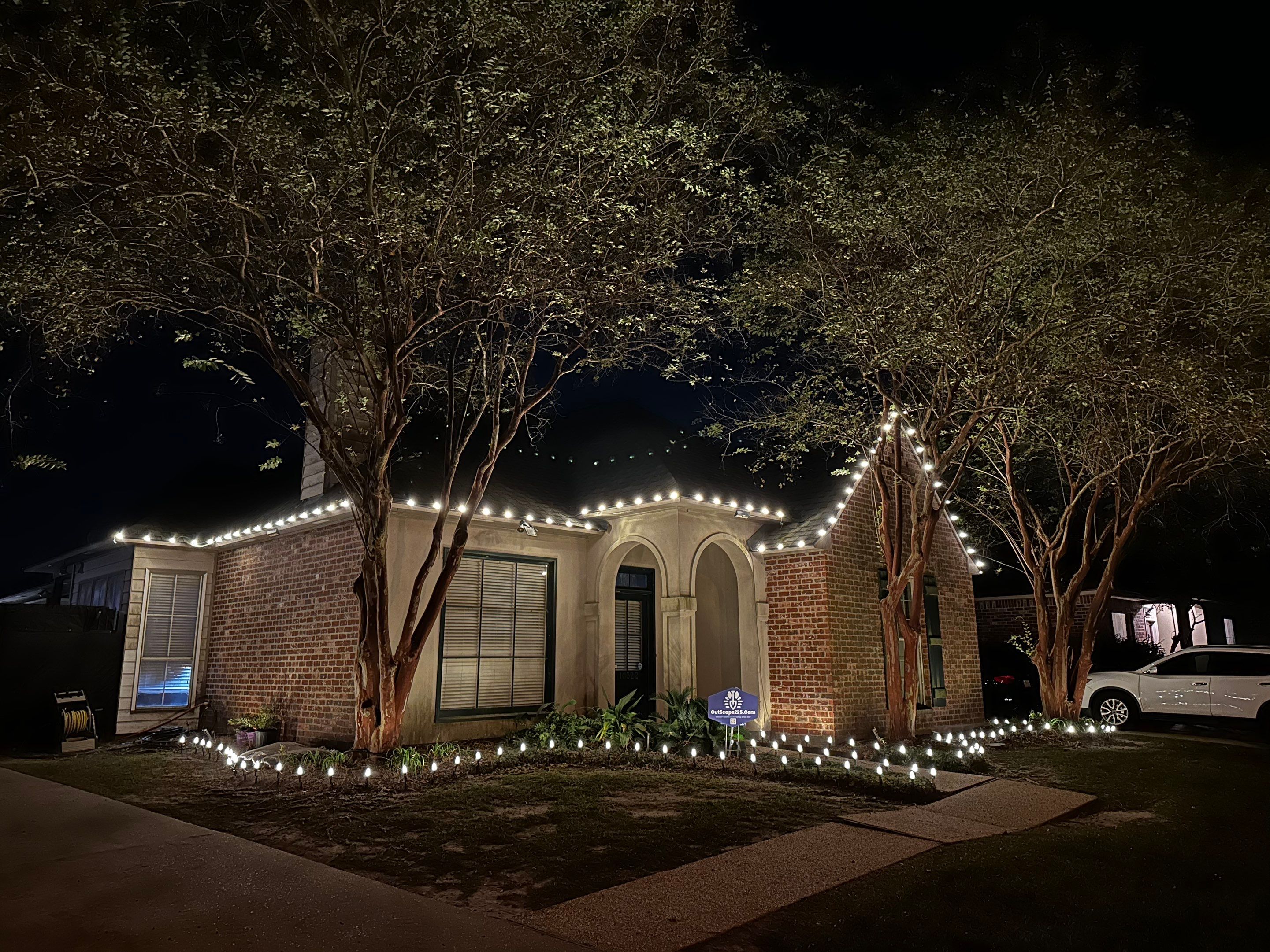 WINTER SERVICES: HOLIDAY LIGHTING using ROOFLINE PERIMETER LIGHTING: HALLOWEEN THEME WITH ORANGE AND PURPLE BULBS by CutScape, LLC.