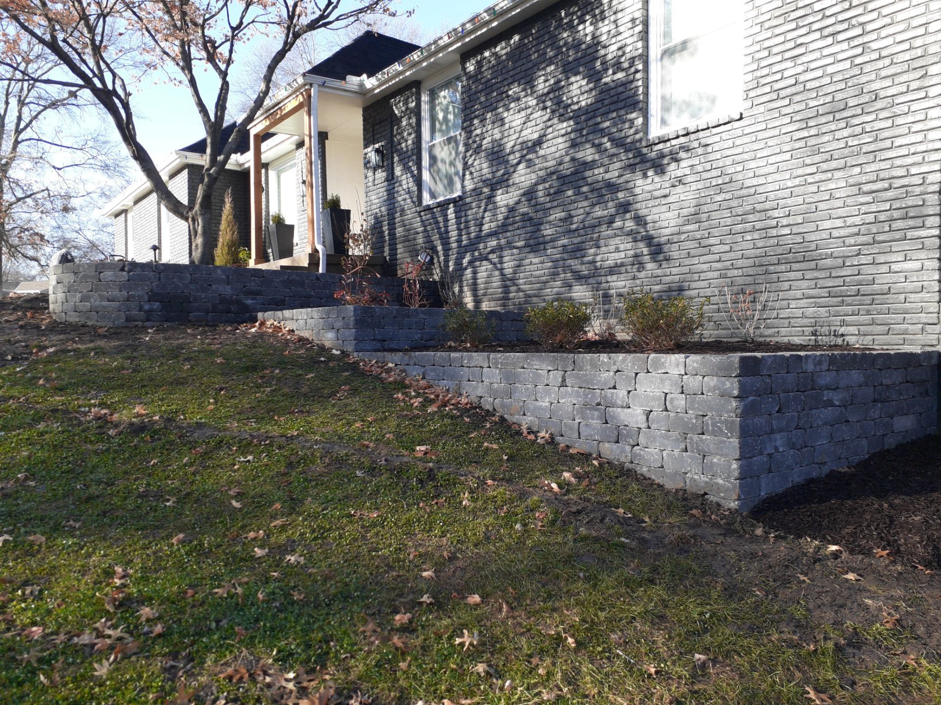 Entire Home Landscape and Retaining Walls by LAND ESCAPES LLC