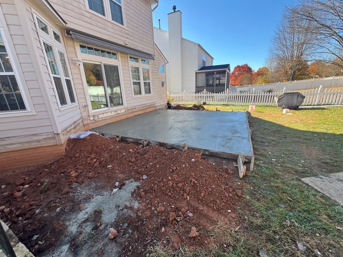 Custom Screened-In Porch with Stamped Concrete Patio in Warrenton by Jakari Restoration & Construction LLC