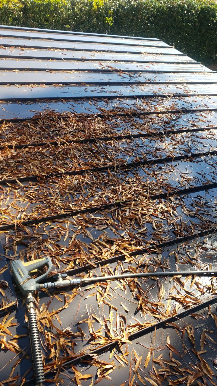 Sara Gutter cleanout using water by Power Wash Masters LLC