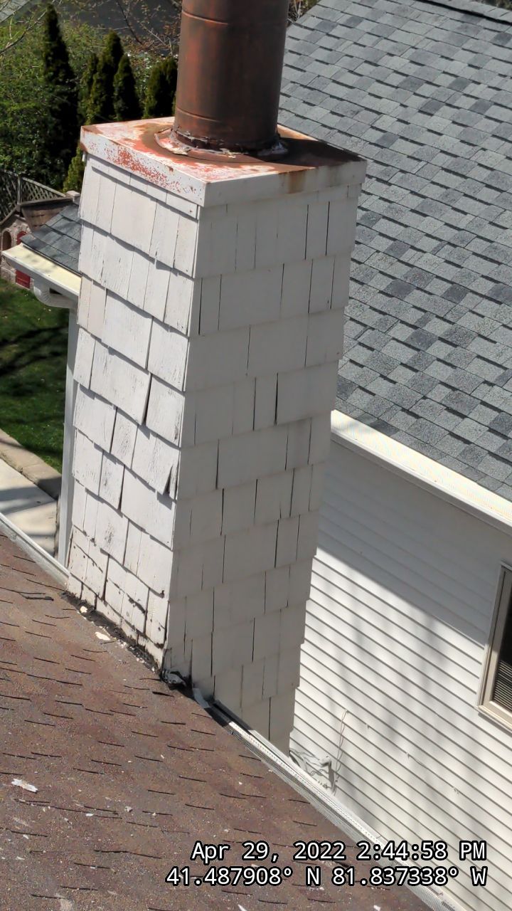 Residential Roofing Installation, Dec-tek walk-out porch roof, siding on garage by Absolute Roofing and Construction