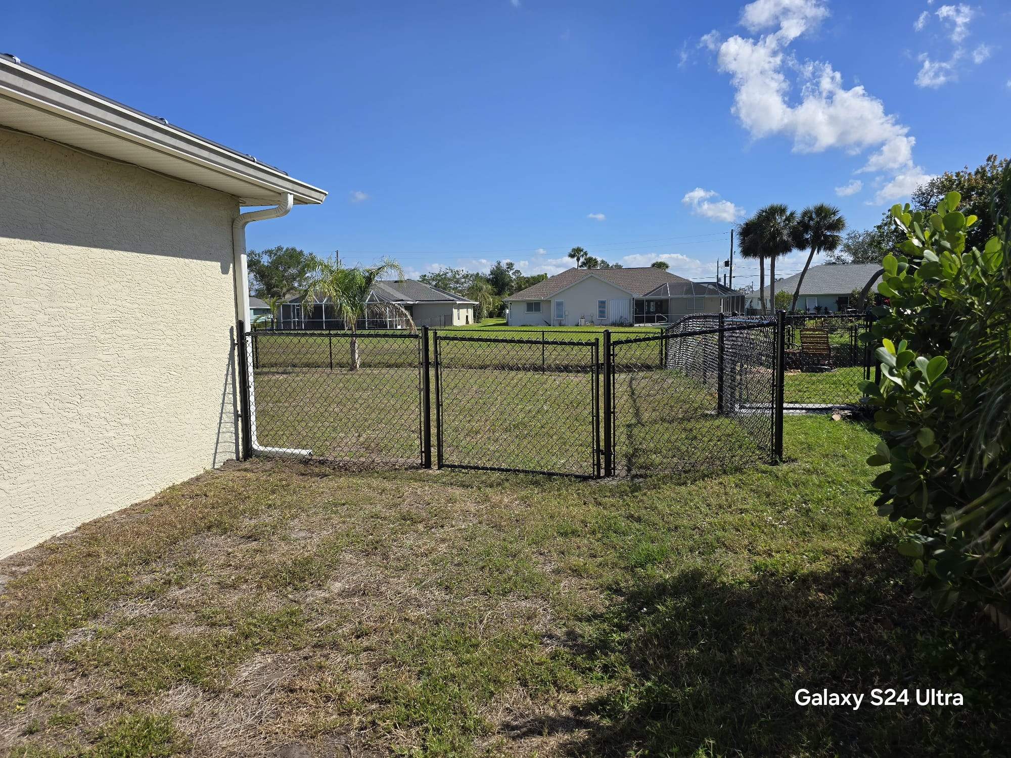 Waterfront Black Chain Link Fence Installation in Rotonda West by True Fence LLC