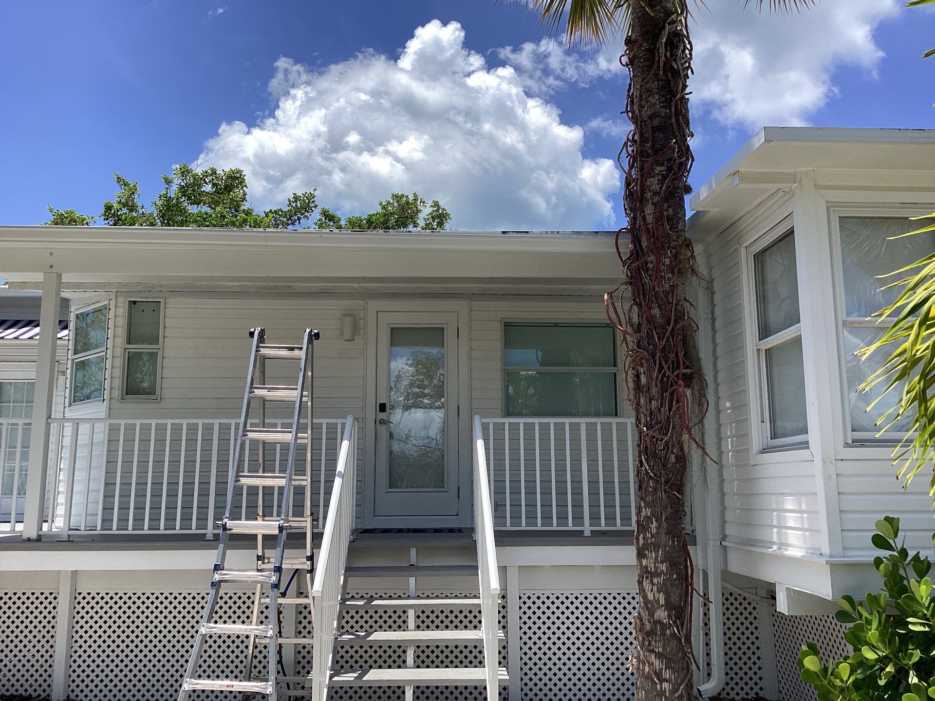 Downspout Installation using Charcoal Grey in Sanibel FL by Gutter Professors