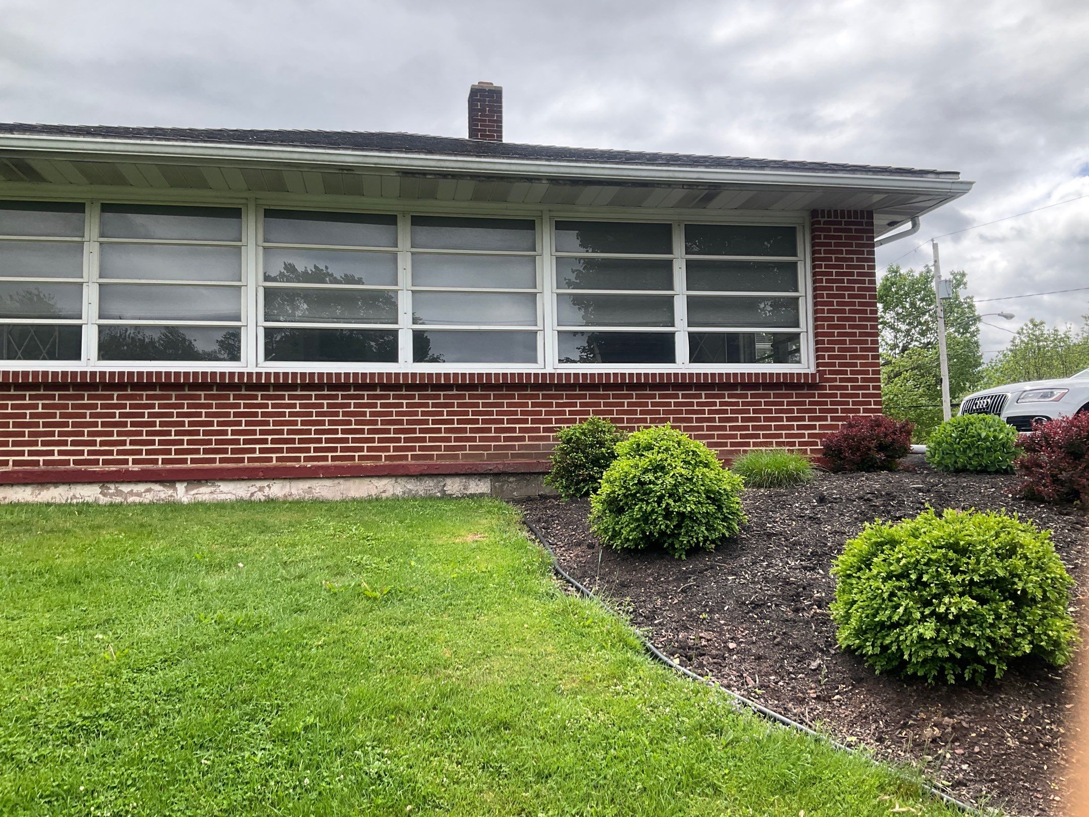 Tower City Residential Addition Featuring Gray Vinyl Siding and Garage by Esh Builders