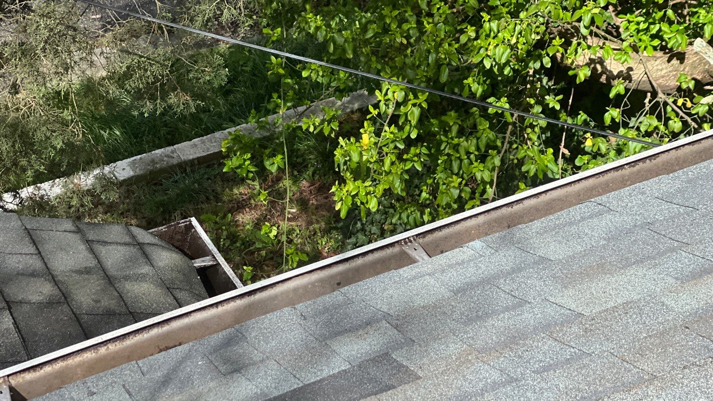 Gutter Cleaning using brown bags by Roof Bullies