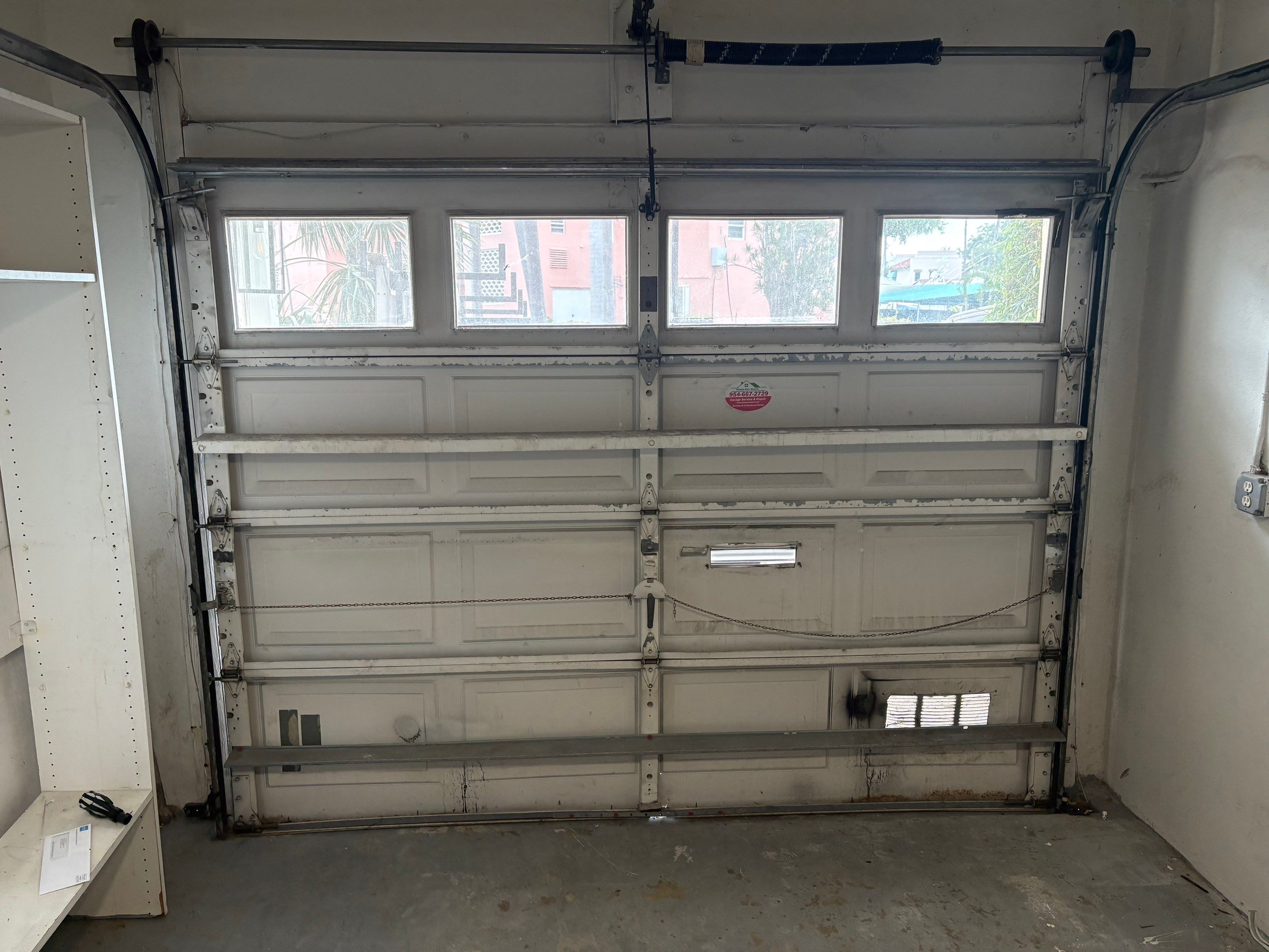 Clopay Modern Steel Garage Door Installation in Fort Lauderdale by The Door Doctor of South Florida, Inc.