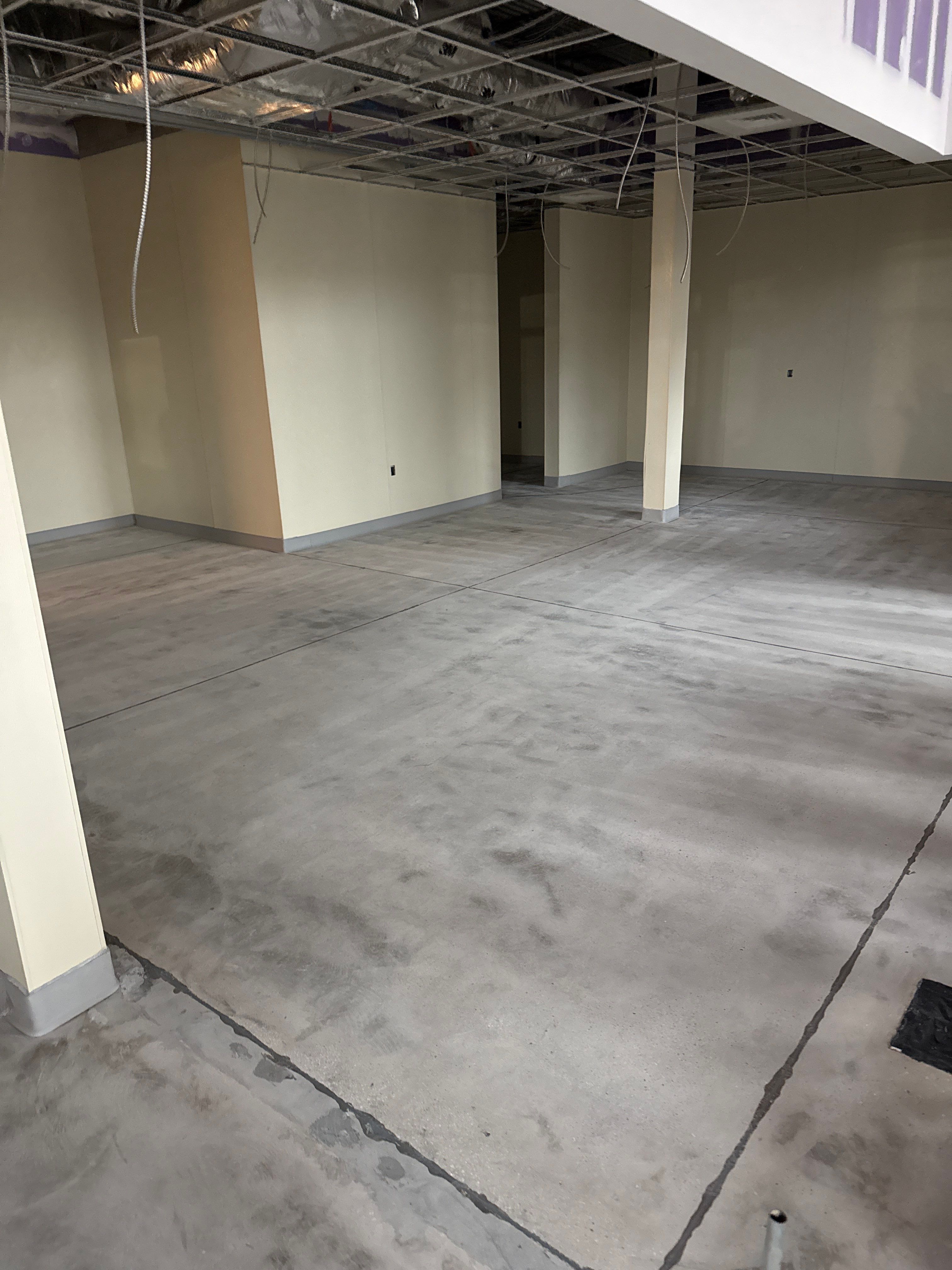 Industrial Epoxy Flake and Concrete Overlay Floor Installation in Pensacola by Cornerstone Hard Surface Restoration