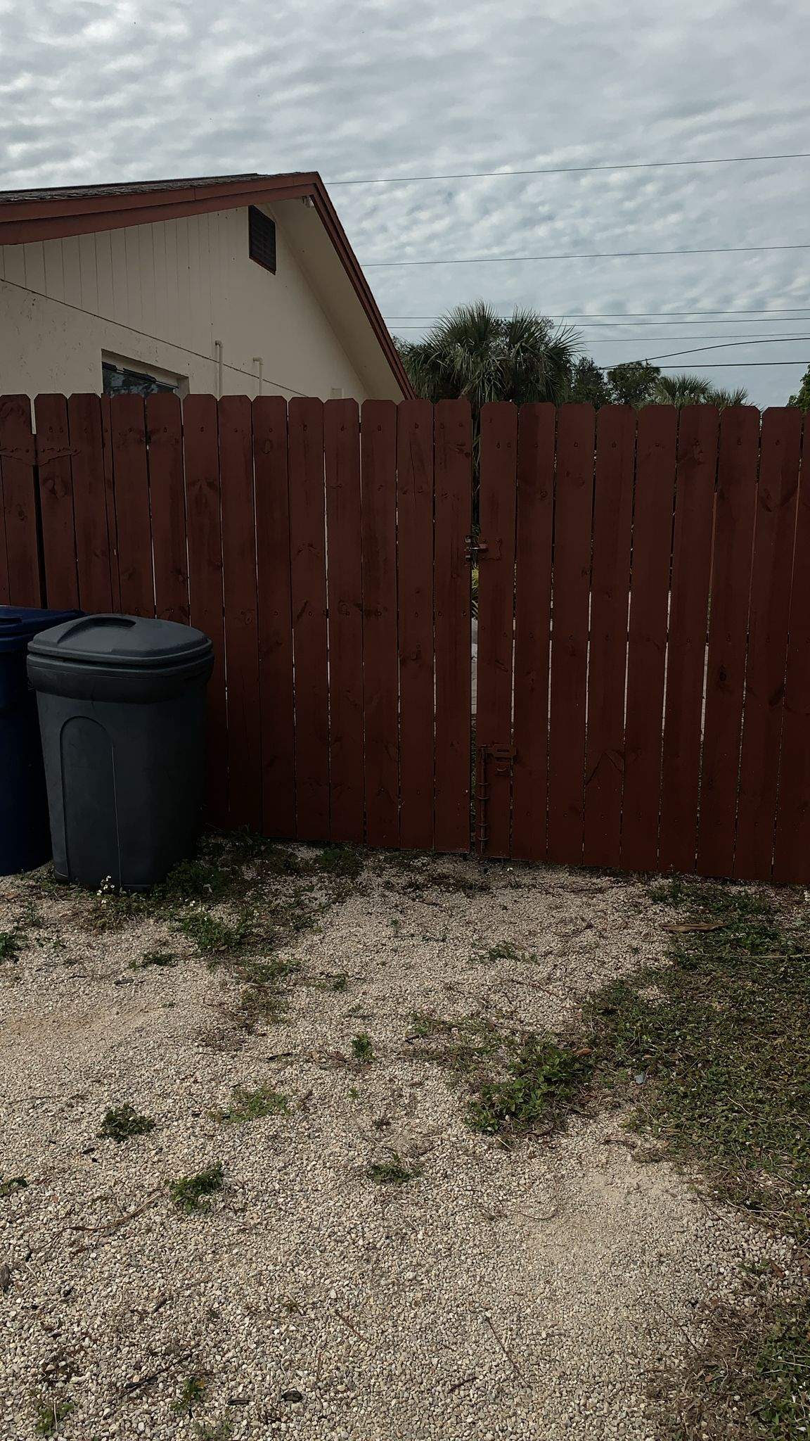 Red-Stained Wood Privacy Fence and Gate Repair in Venice by True Fence LLC
