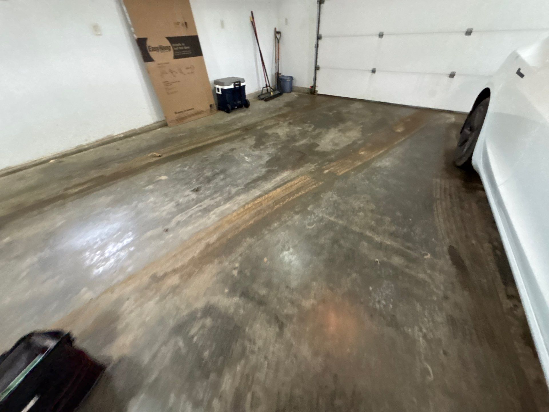 Full Garage Floor and Basement Stair Epoxy Coating in Sioux Falls by Select Painting, Coatings & Garage Cabinets