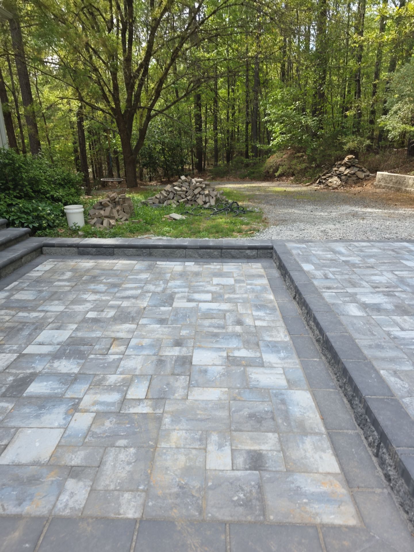 Pittsboro Outdoor Living Transformation – Retaining Wall, Paver Patio & Elevated Deck by Elite Remodeling and Design LLC