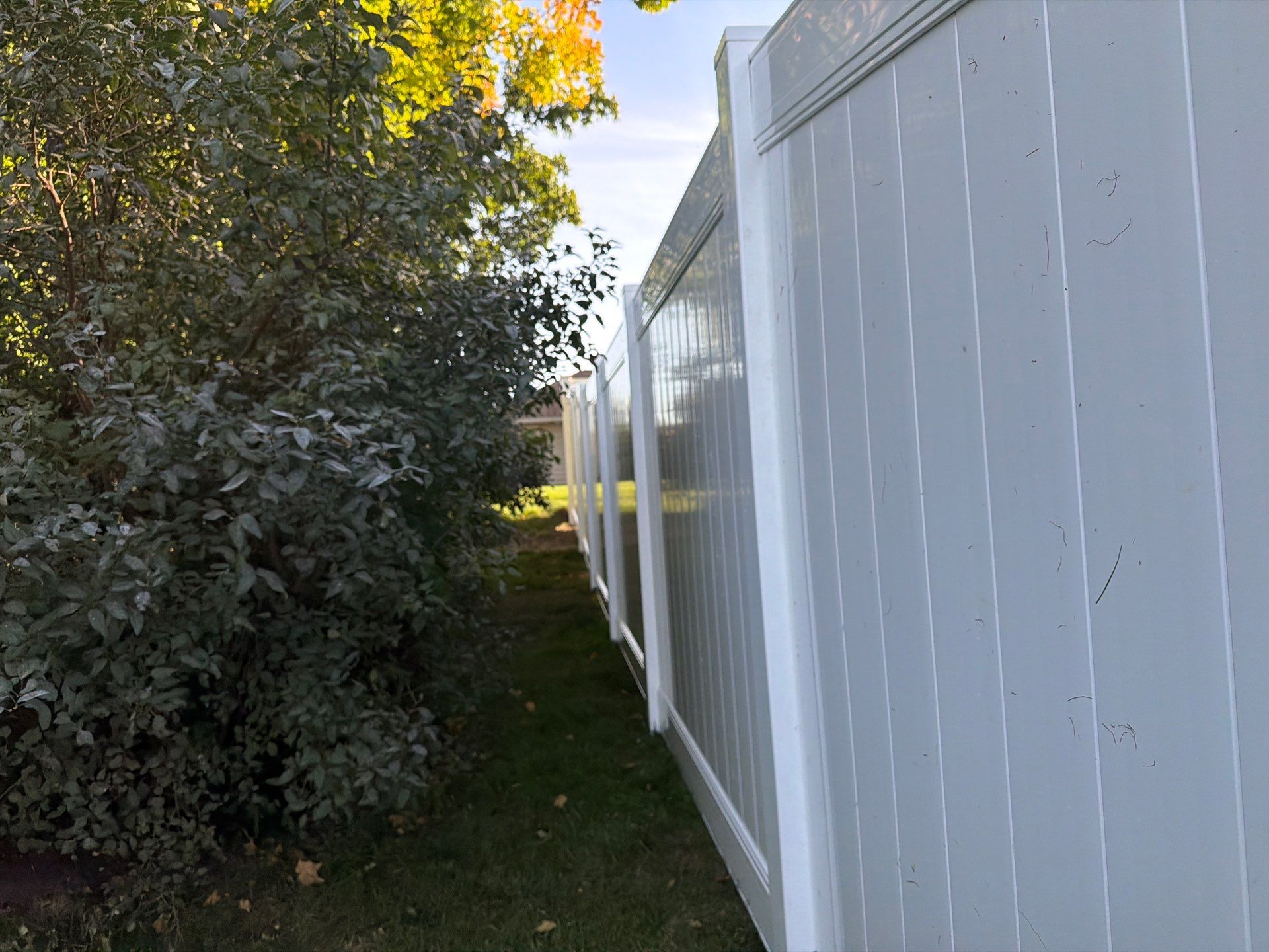 White Vinyl Privacy Fence and Gate Installation in Grundy Center by Perfect Picket Fence and Stain
