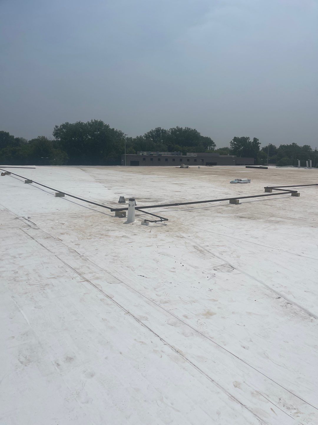 Ford Dealership - Re-Roof by Pink Roofing