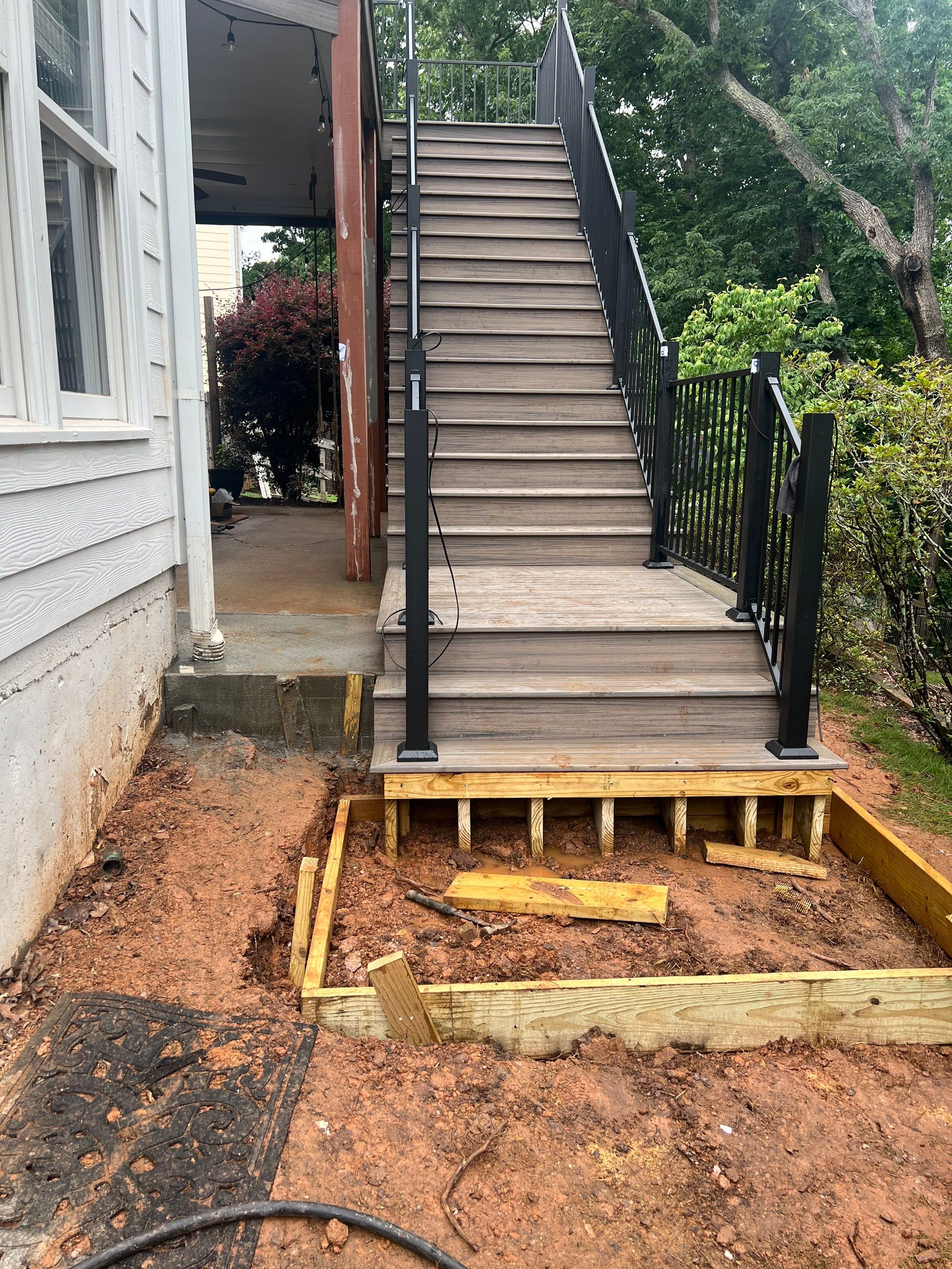 Elevated Composite Deck and Concrete Landing Installation in Kennesaw by Swift Home Renovations