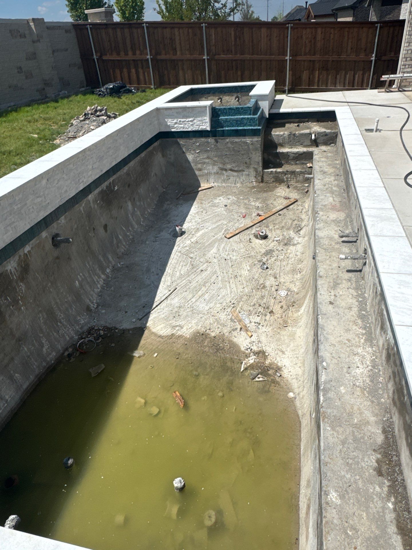 Geometric Pool with Inset Spa and Dark Interior by Pinnacle Pools and Spas - DFW